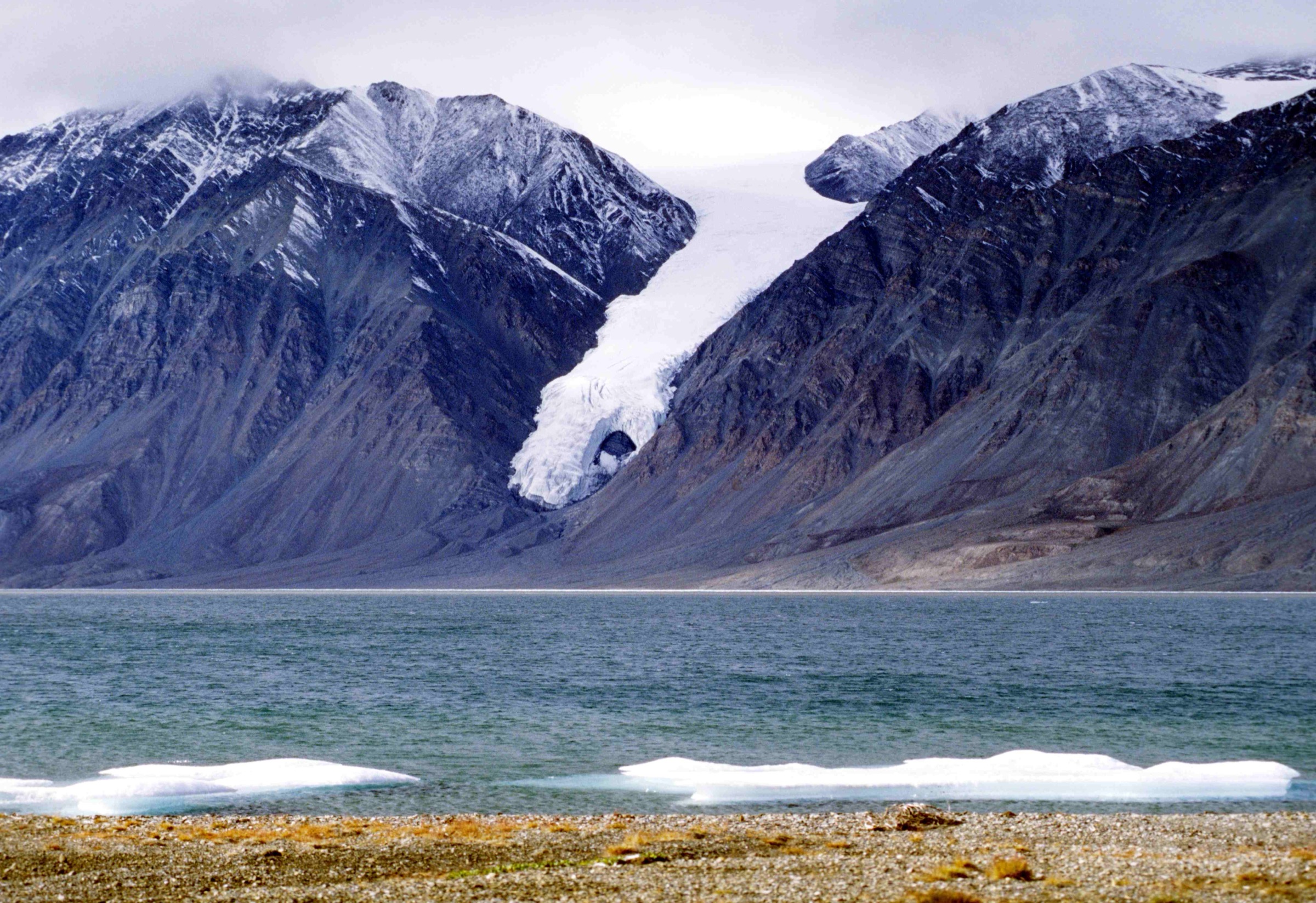 Gull Glacier calving into Tanquary Fiord opposite the Parks Canada warden station