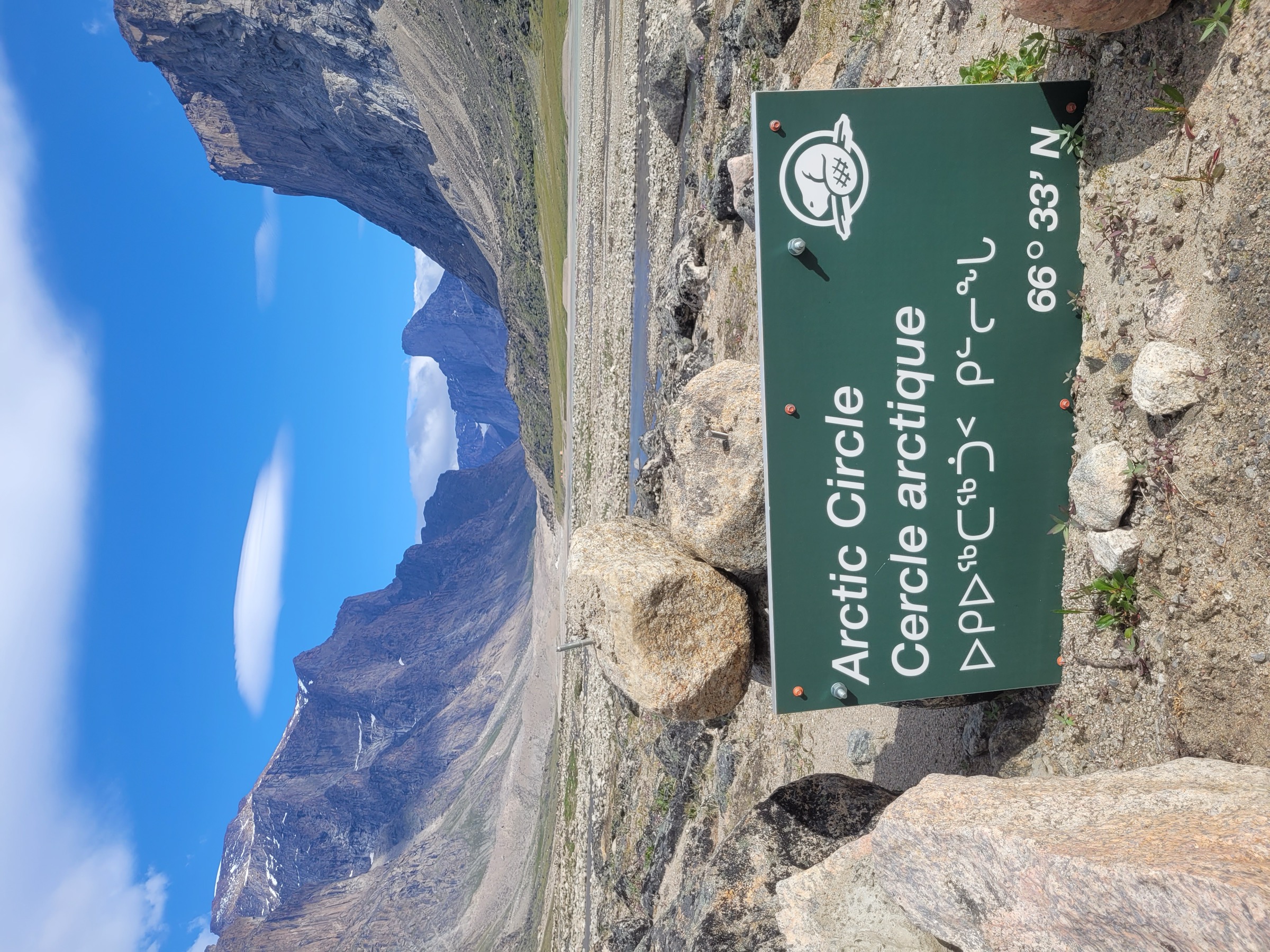Parks Canada Arctic Circle marker beside the Weasel River, Auyuittuq National Park