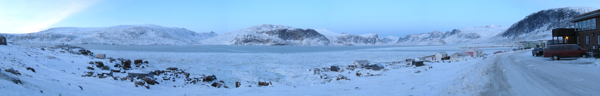 Panoramic view of Pangnirtung Fiord and the hamlet of Pangnirtung at the foot of Mount Duval