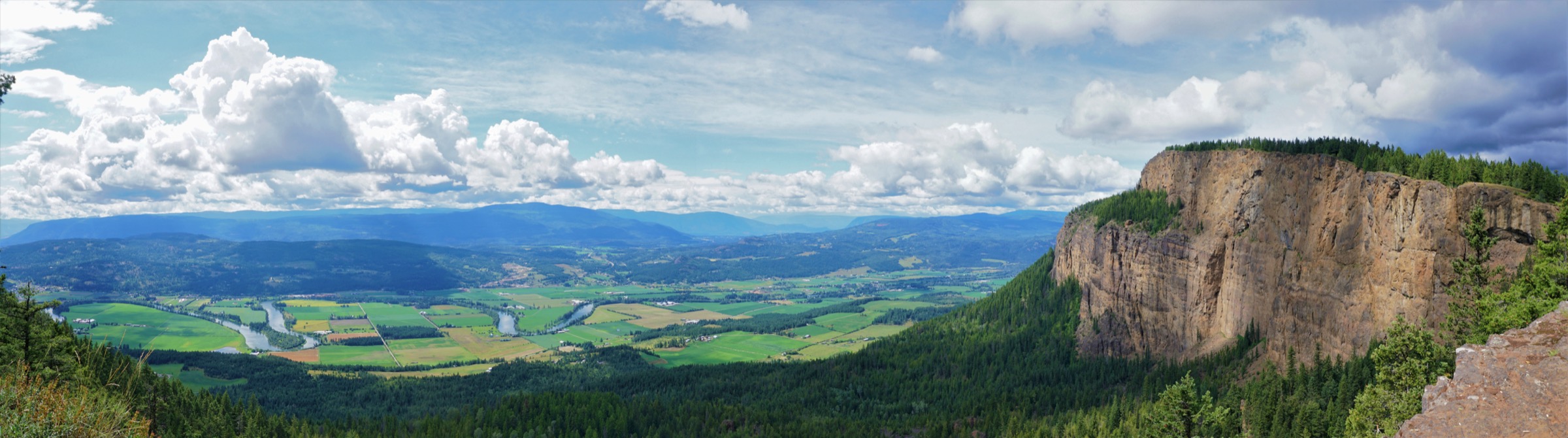 A wide panorama from the top of the Enderby Cliffs across the Shuswap River valley