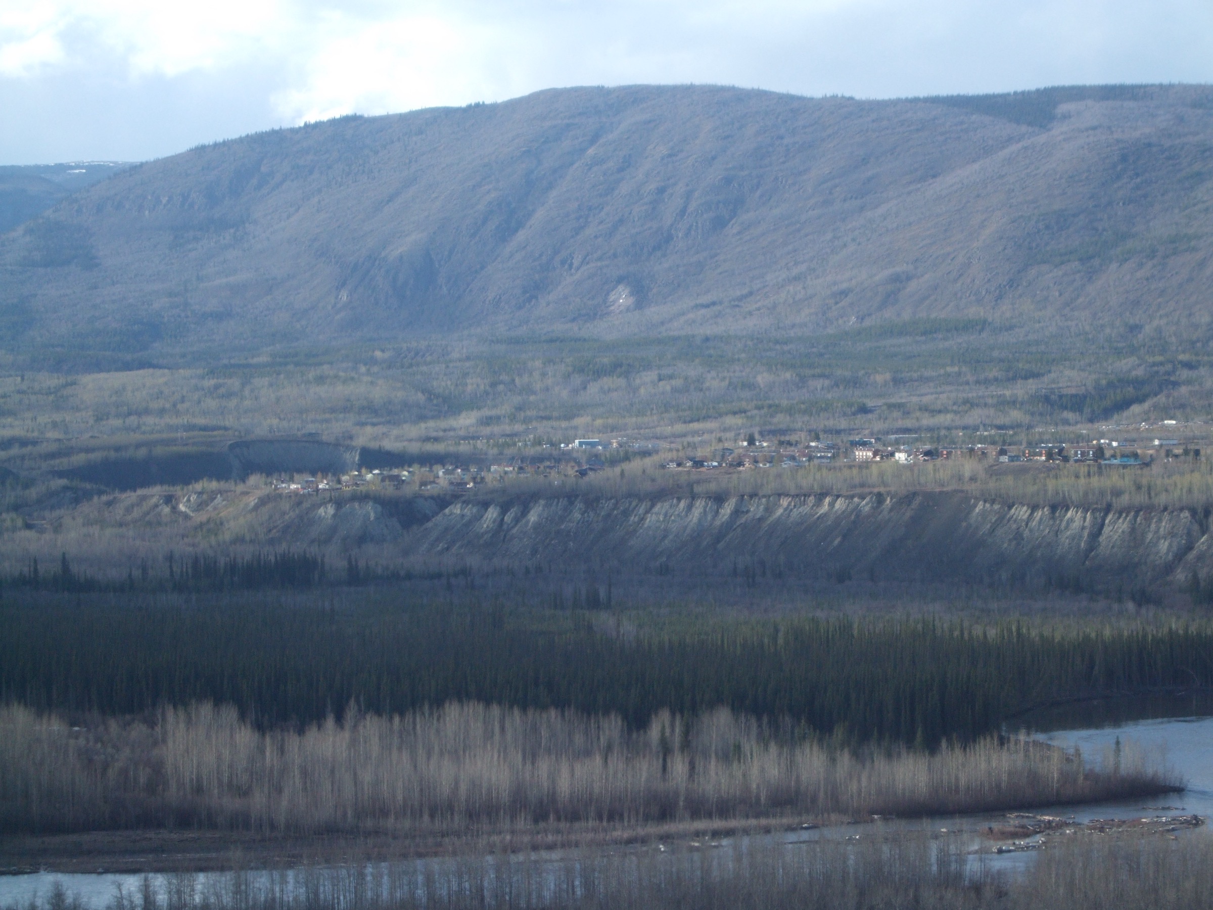 Aerial view of the town of Faro on the Pelly River, with the Anvil Range behind