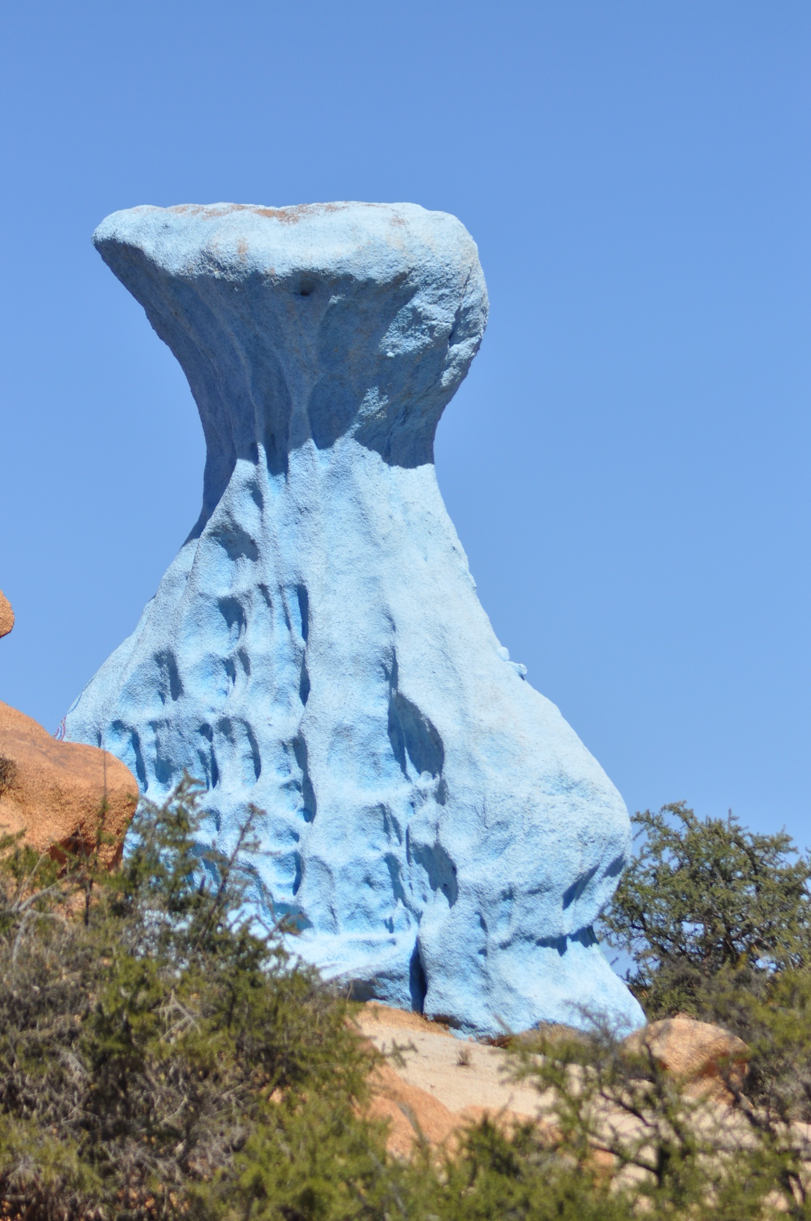 Blue-painted granite boulders in the Painted Rocks landscape near Tafraoute, Anti-Atlas