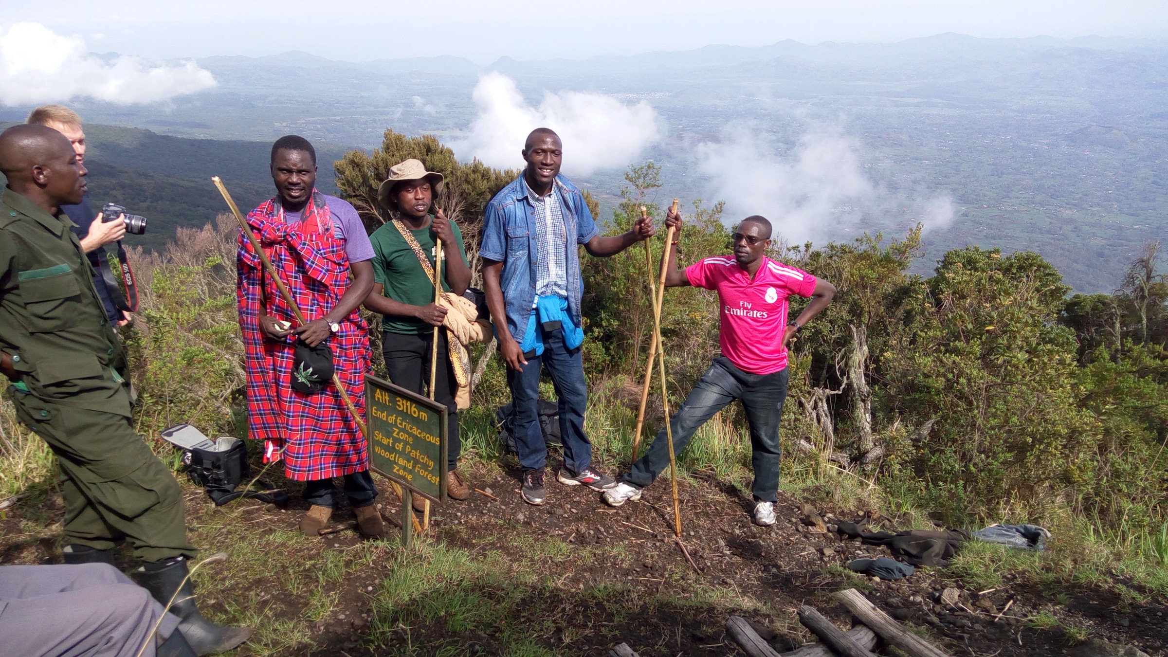 Team of hikers ascending Mount Muhabura in Mgahinga Gorilla National Park, Uganda