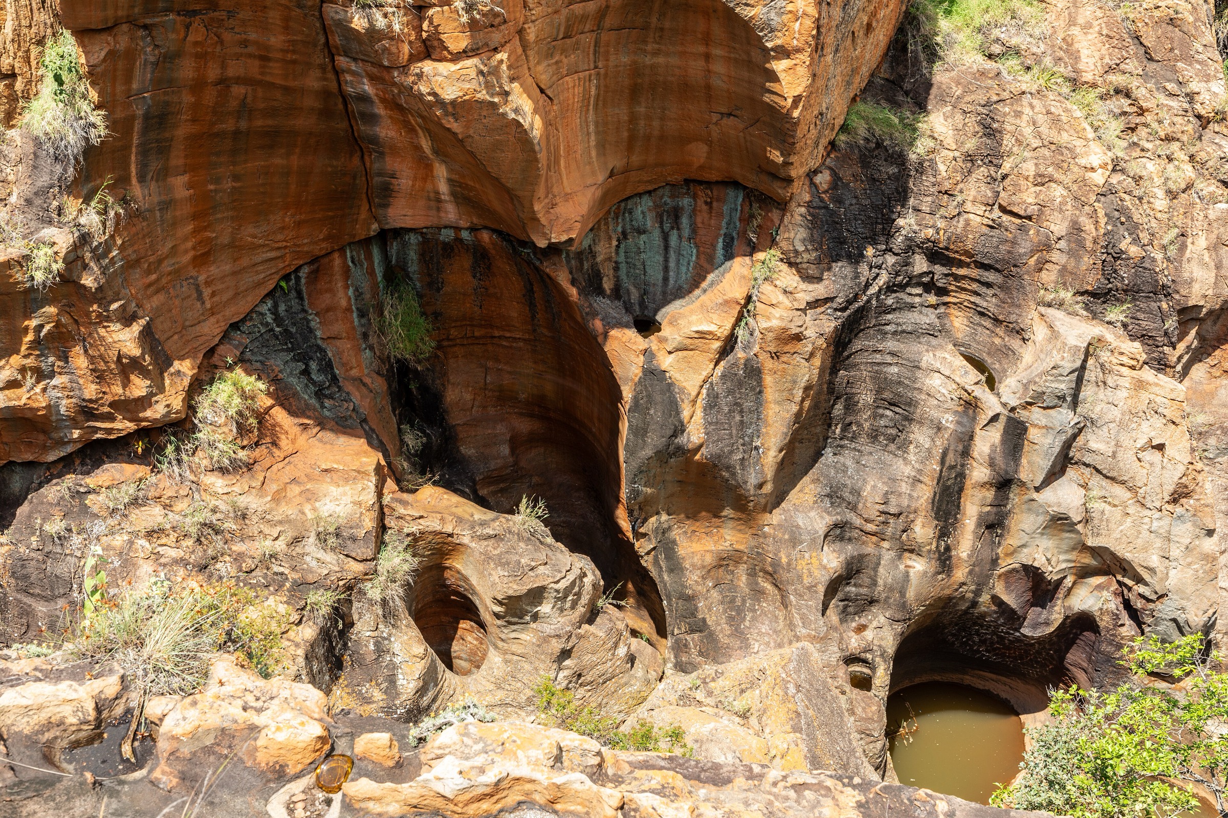 Cylindrical potholes carved into rock at Bourke's Luck Potholes