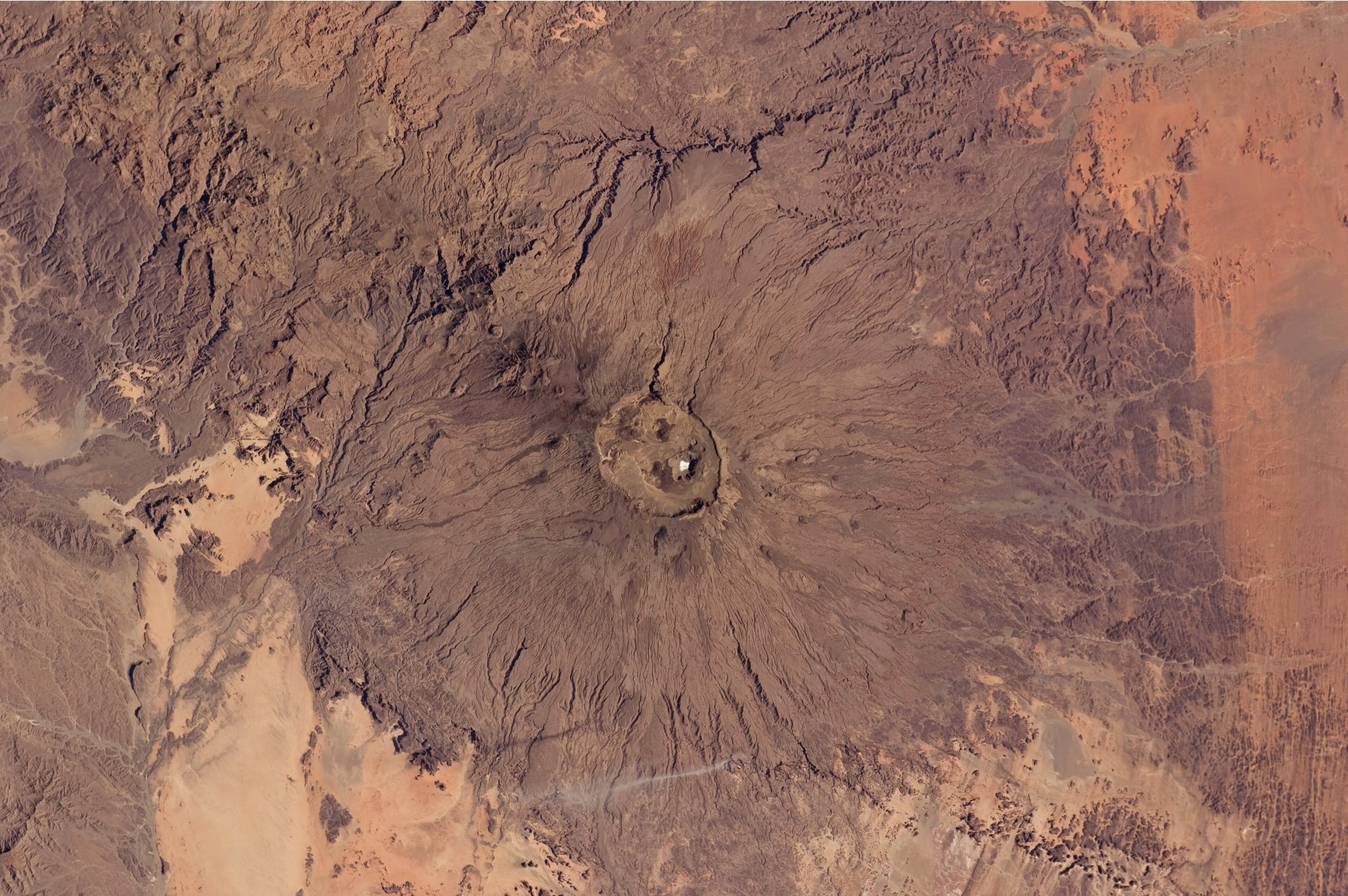 Emi Koussi volcano and its summit crater seen from the International Space Station