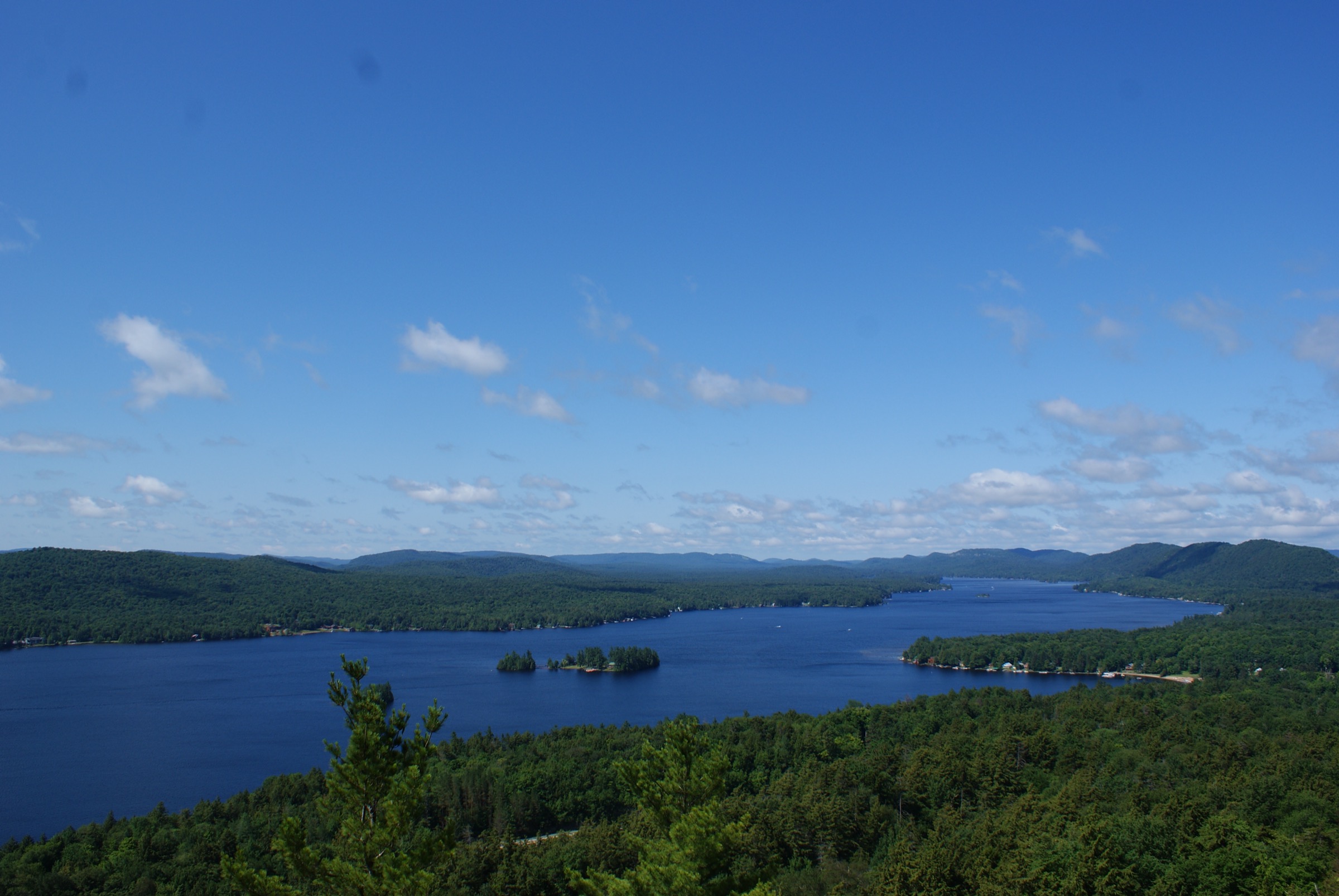 Fourth Lake seen from the open summit of Rocky Mountain above Inlet