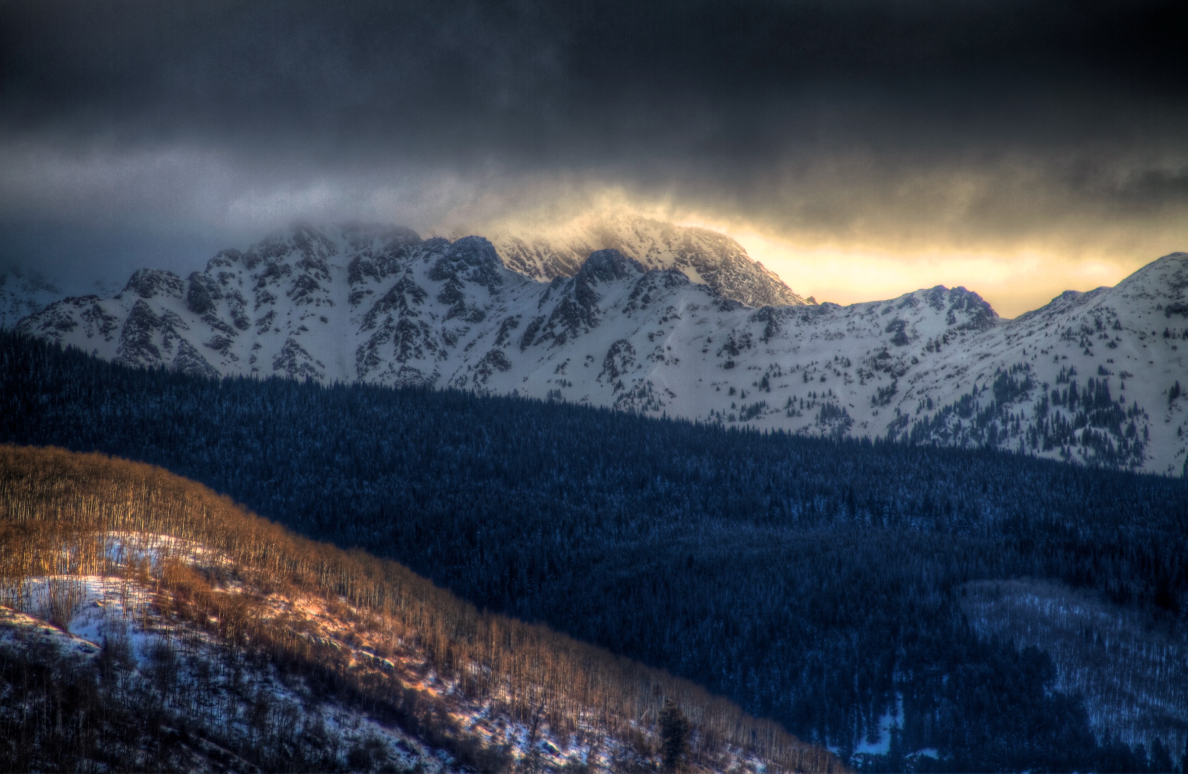 The Gore Range crest at sunrise, seen from the Vail side above the Booth Creek cirques