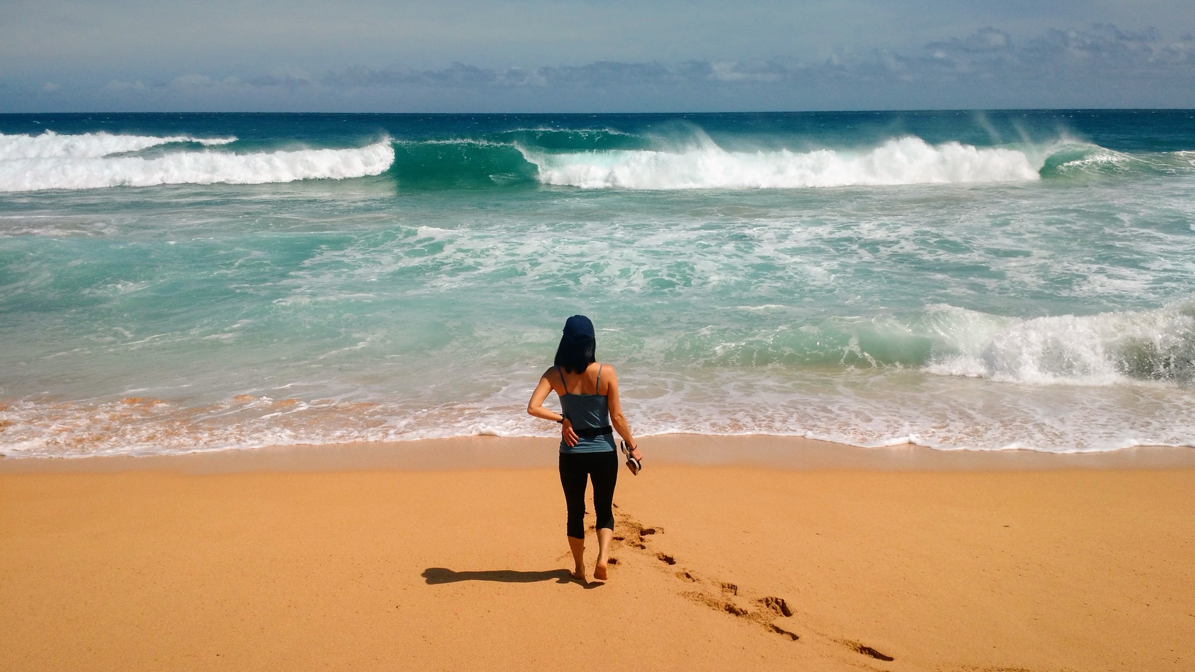 Hanakāpīʻai Beach at the two-mile point of the Kalalau Trail, with the Nā Pali cliffs behind