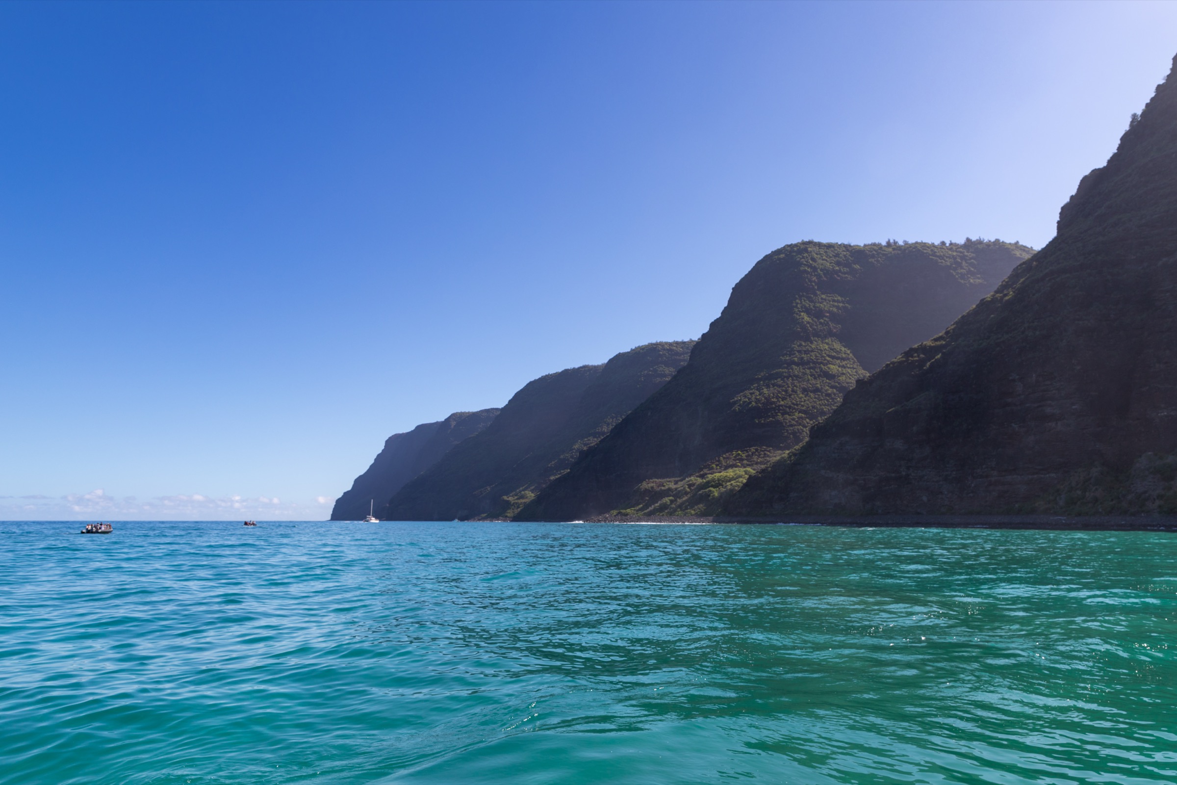 Aerial view of Polihale State Park with the Nā Pali cliffs rising at the north end of the beach
