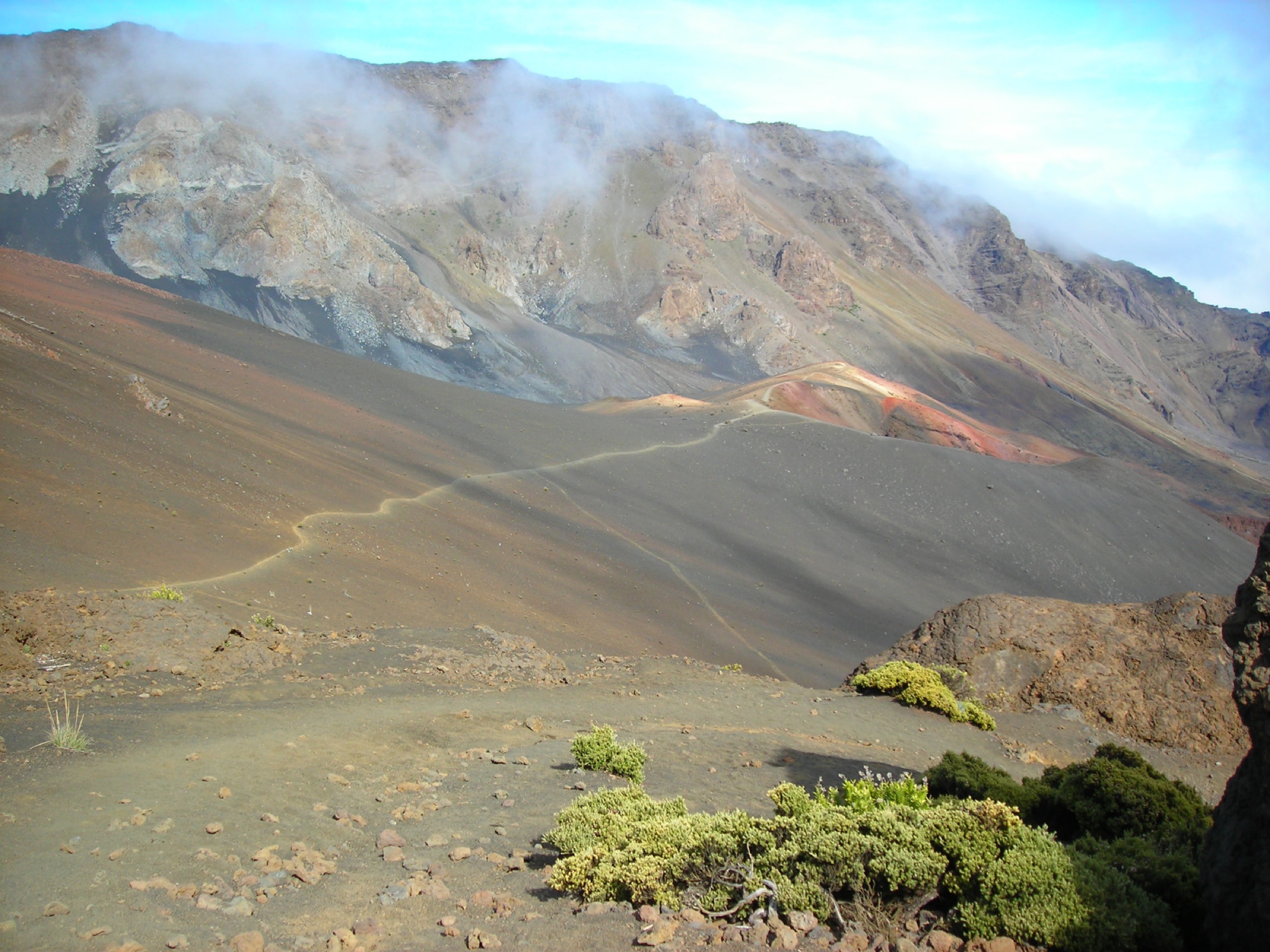 Hikers descending the Keoneheʻeheʻe / Sliding Sands Trail into Haleakalā crater