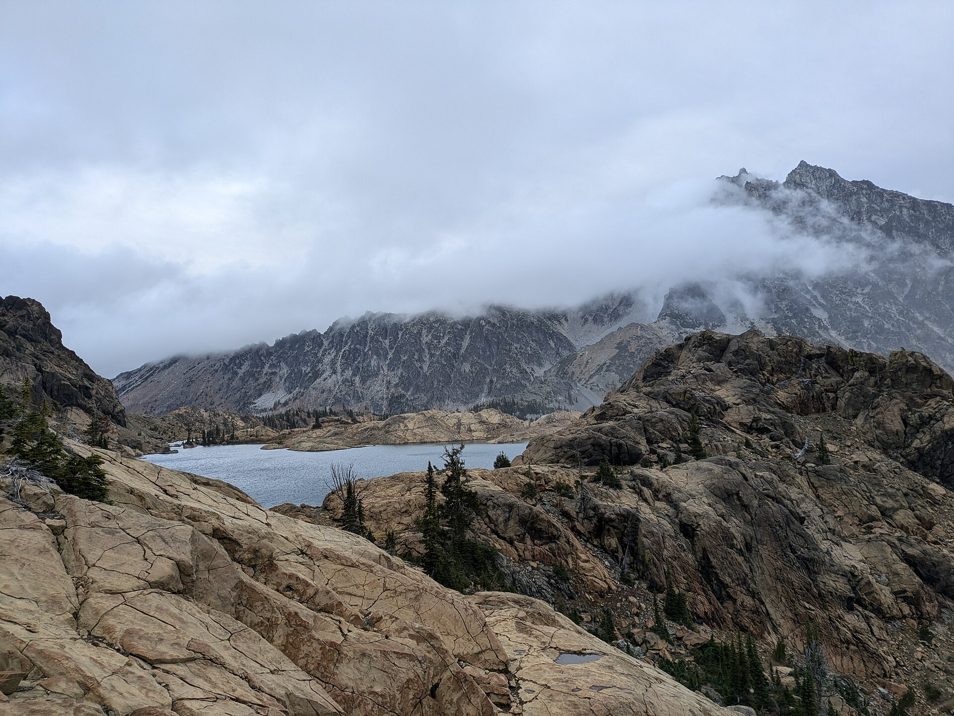 Lake Ingalls in October with golden alpine larches and Mount Stuart beyond