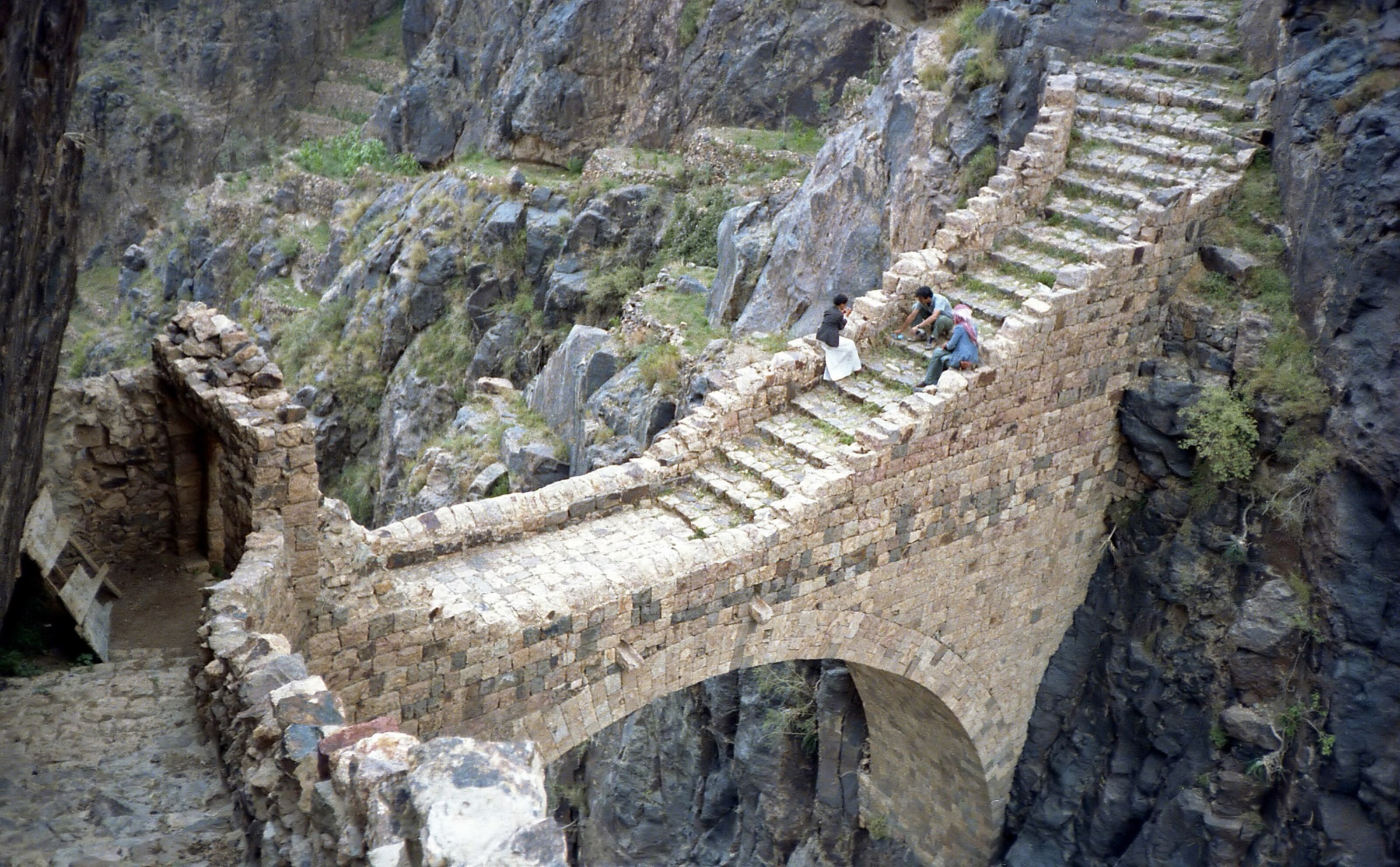 Shaharah stone arch footbridge spanning a gorge in the Amran Governorate, Yemen
