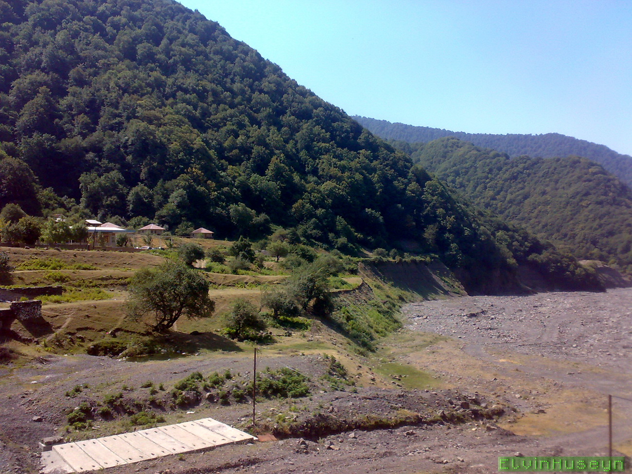 A small settlement, bridge and wooded mountains near Agchay in northwestern Azerbaijan