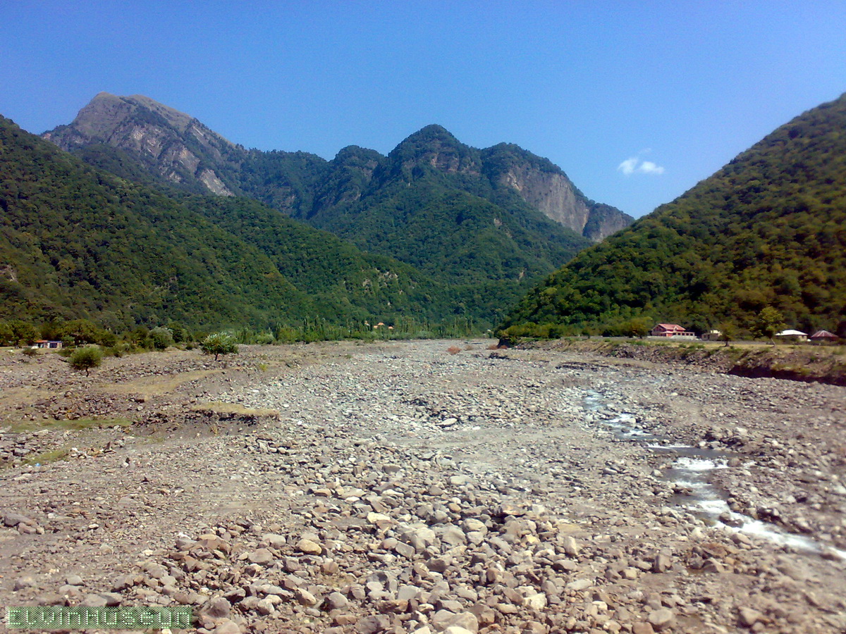 A rocky mountain valley and wooded ridges near Agchay in northwestern Azerbaijan
