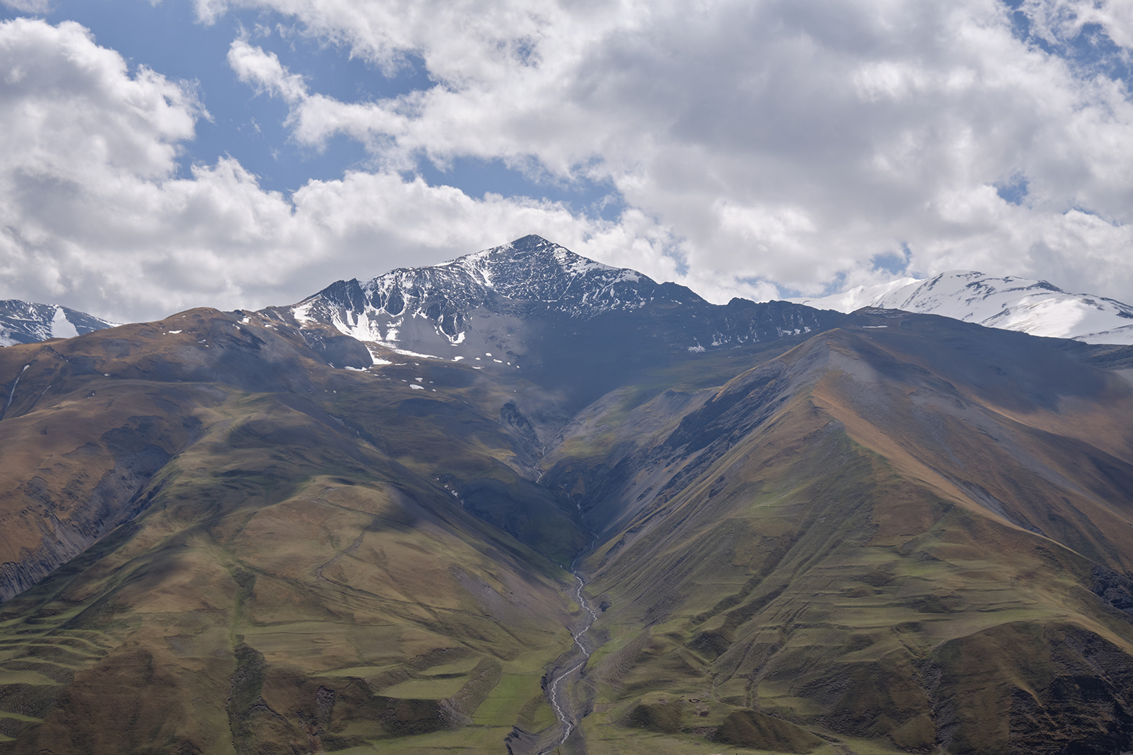 Snow-streaked Greater Caucasus peaks seen from Khinalig