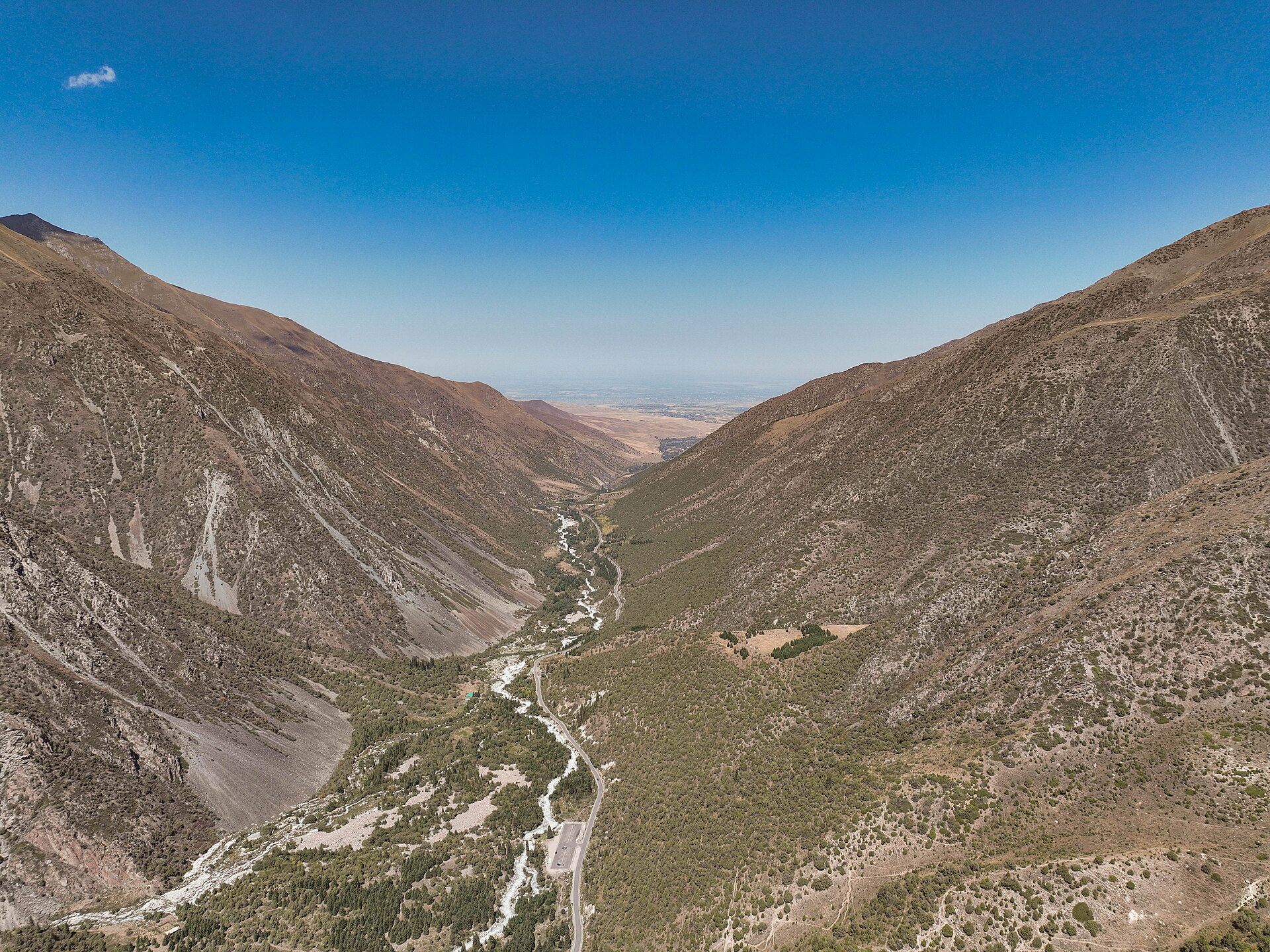 A high view down the dry, deeply cut valleys of Ala-Archa