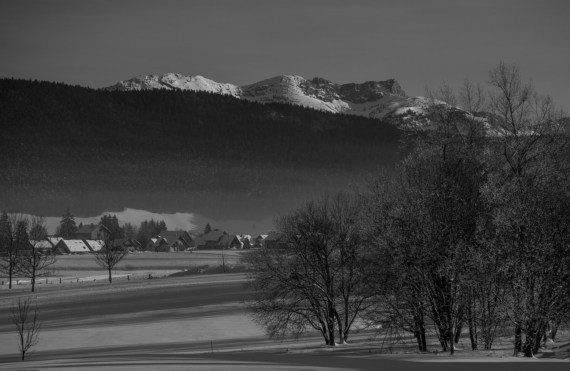 A wide winter valley and snow-covered ridges in the Vercors, France