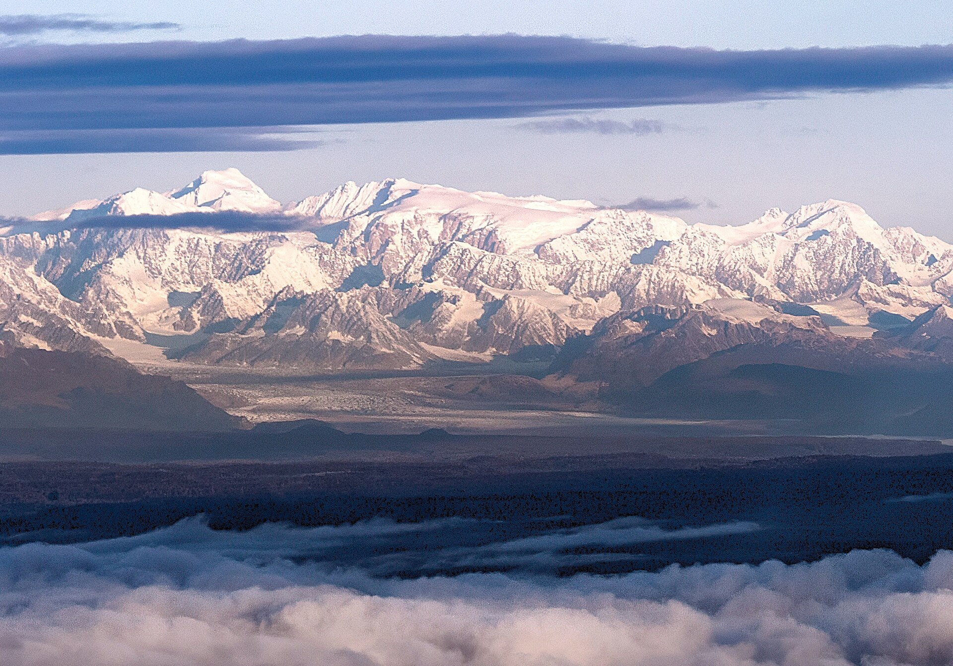 Mount Gerdine and the snowy Tordrillo Mountains seen above a layer of clouds