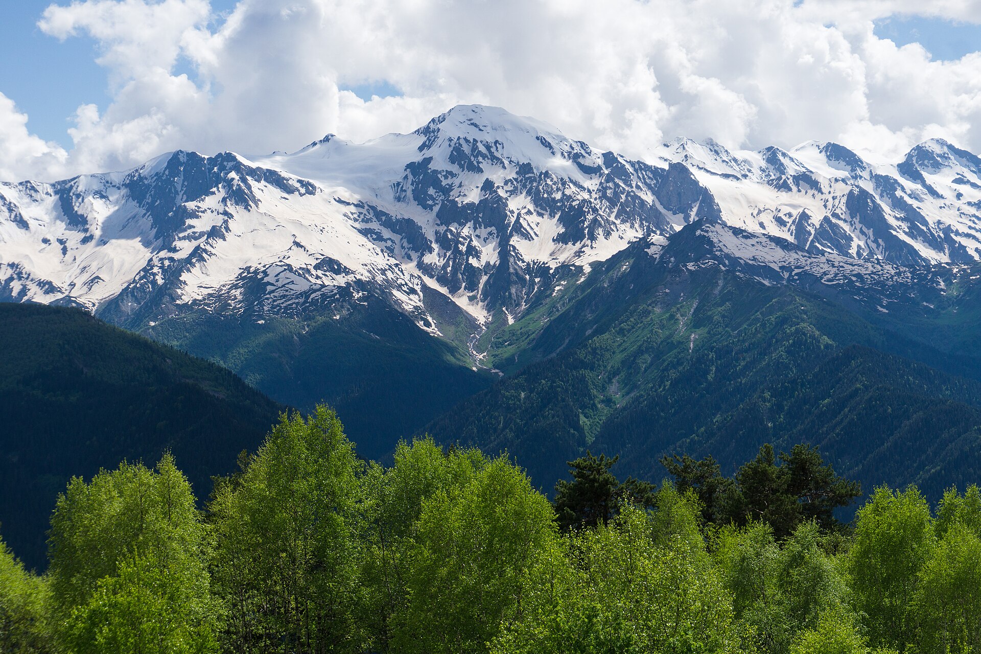 The snow-streaked Greater Caucasus seen from Mount Zuruldi above Mestia