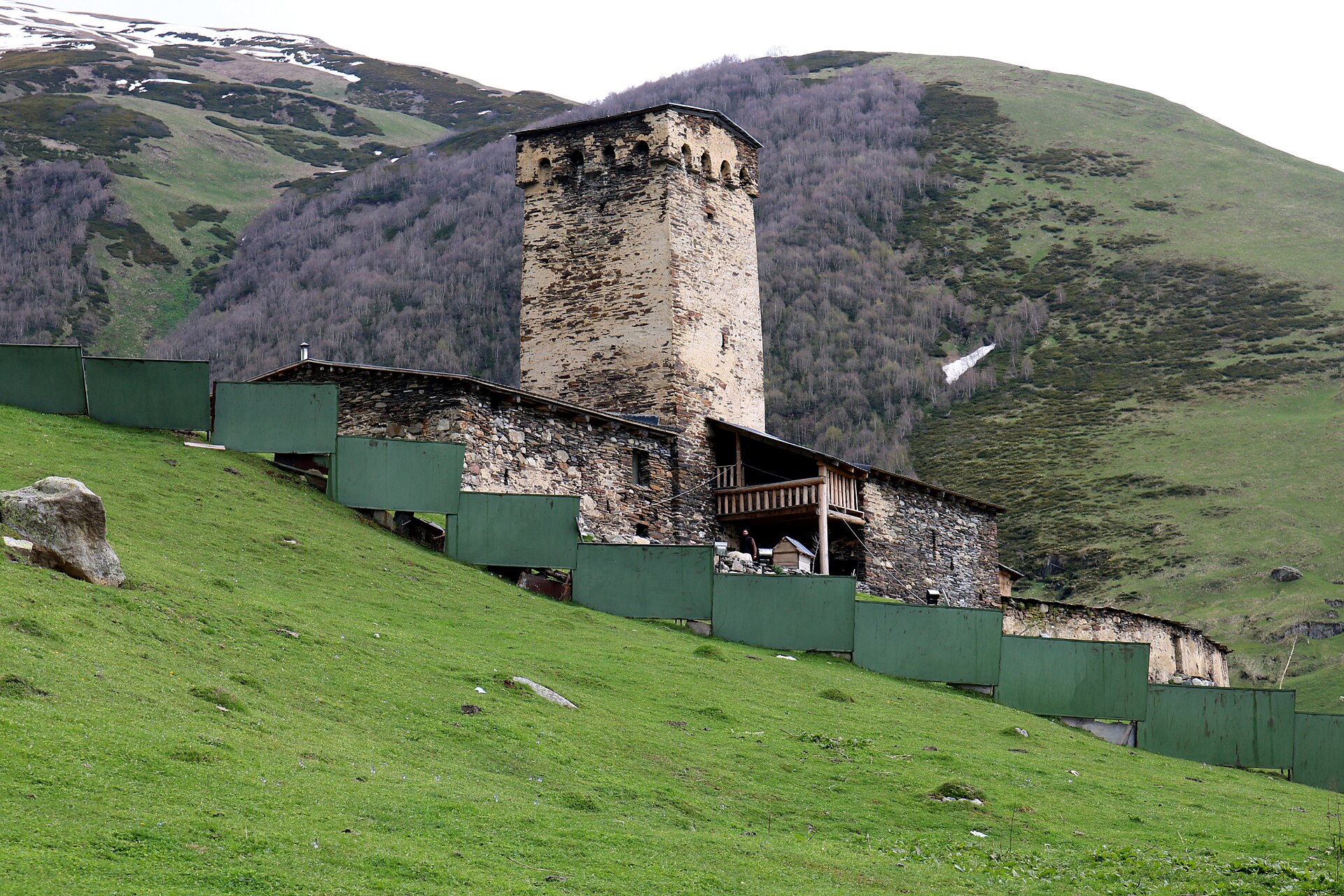 Lamaria church and a defensive tower in the green high valley of Ushguli