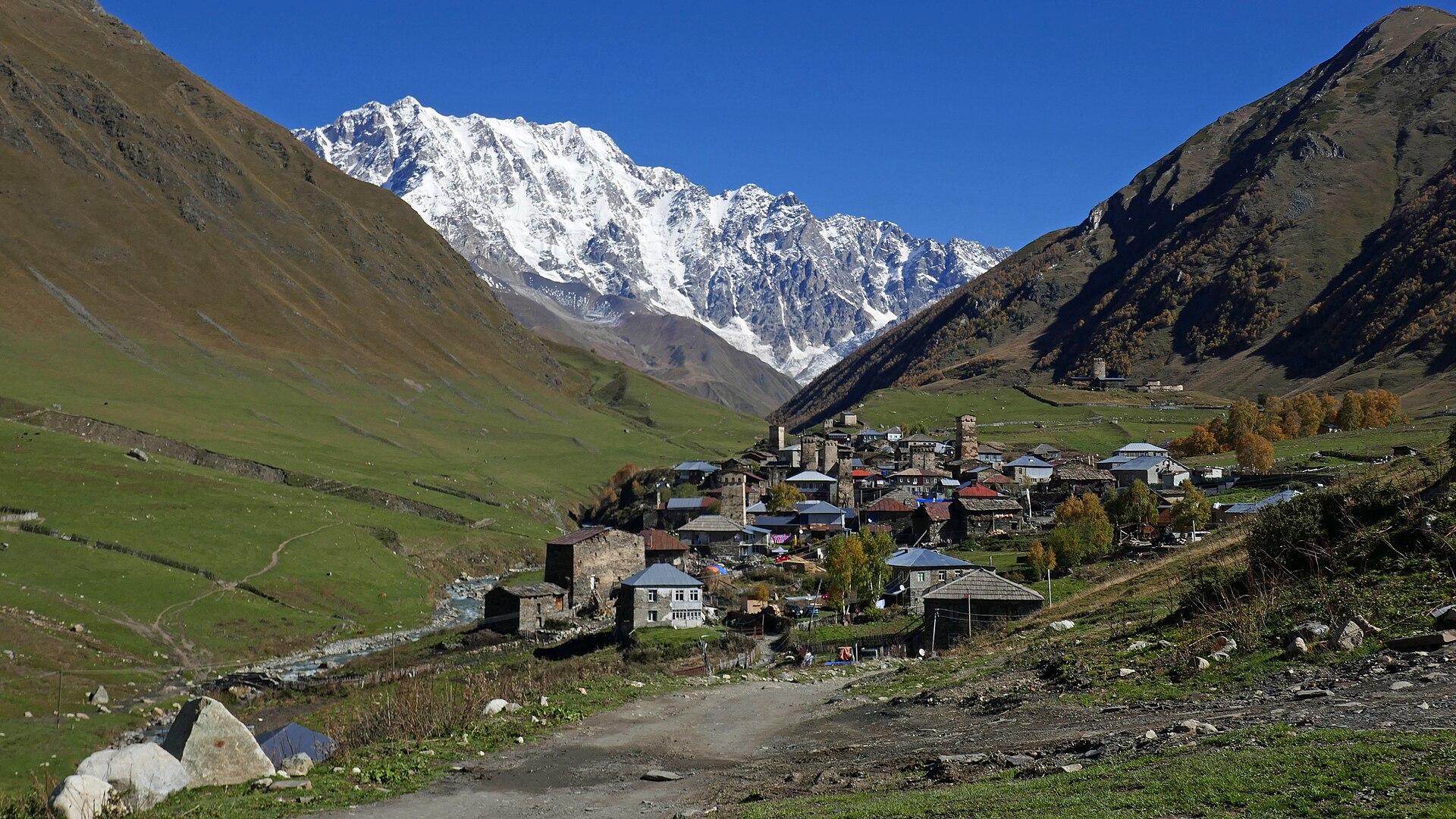Stone towers and houses spread along the high valley at Ushguli