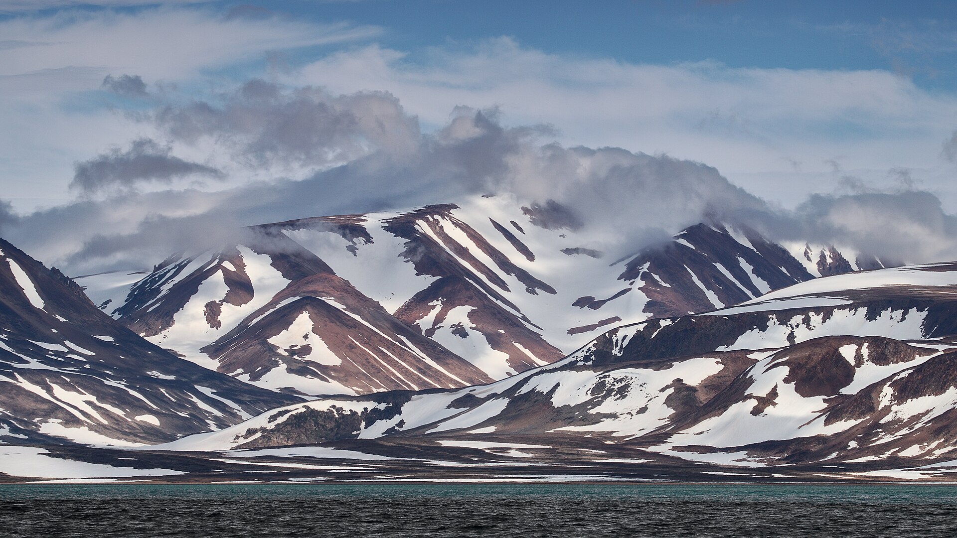 Snow-patterned slopes of Kæmpehøjen in Liverpool Land, East Greenland