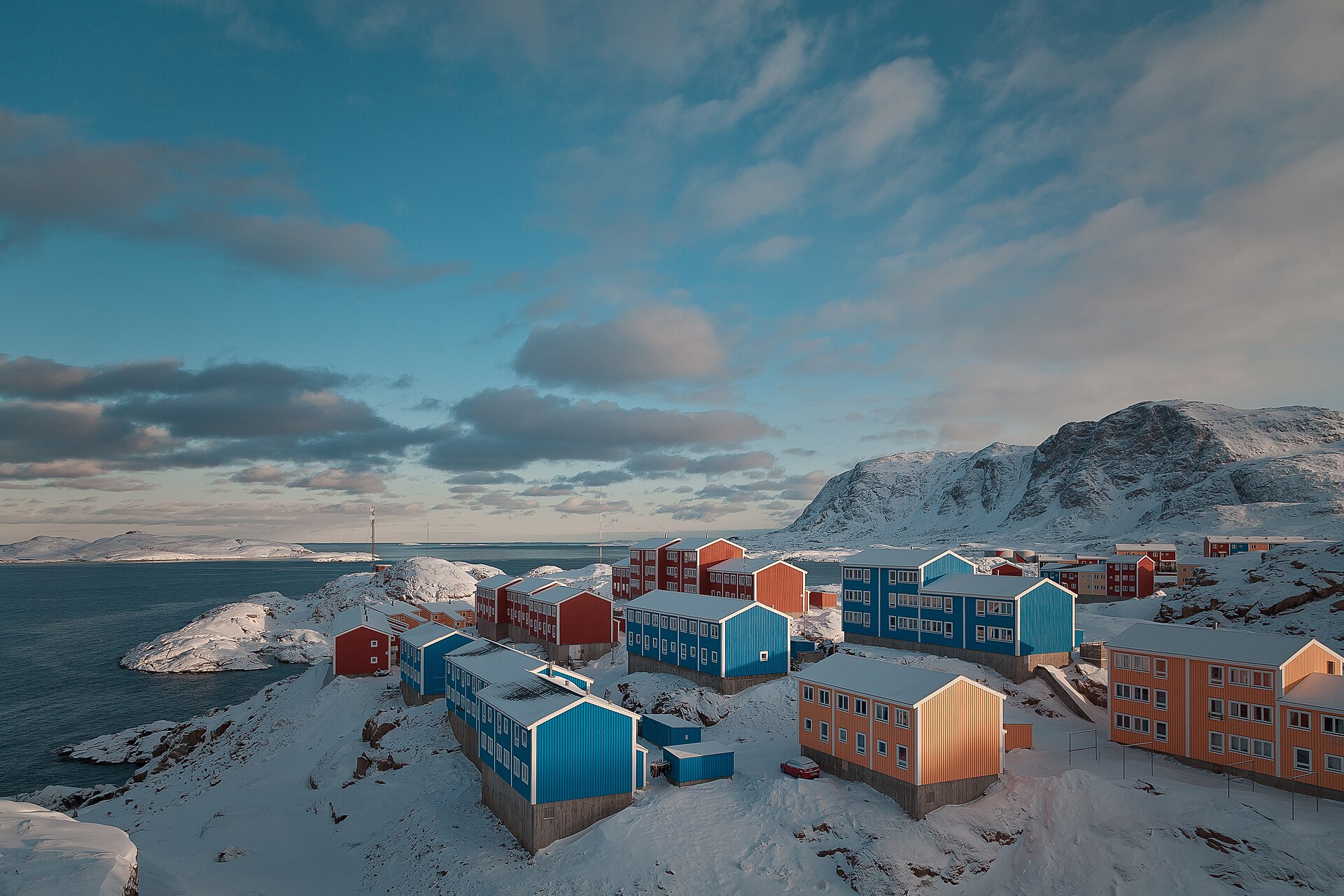 Snow-covered Sisimiut and its surrounding mountains seen from Qiviarfik in May