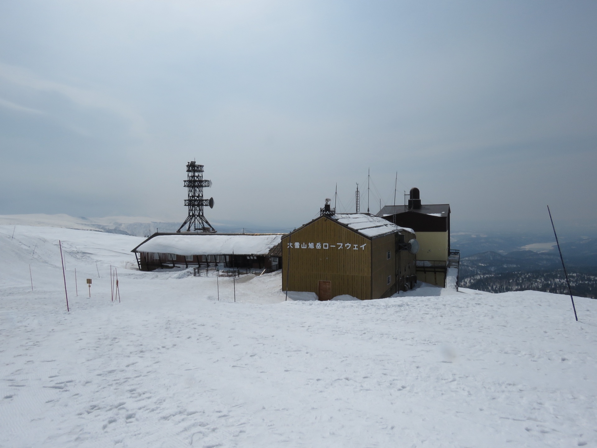The upper Asahidake Ropeway station surrounded by deep snow and mist