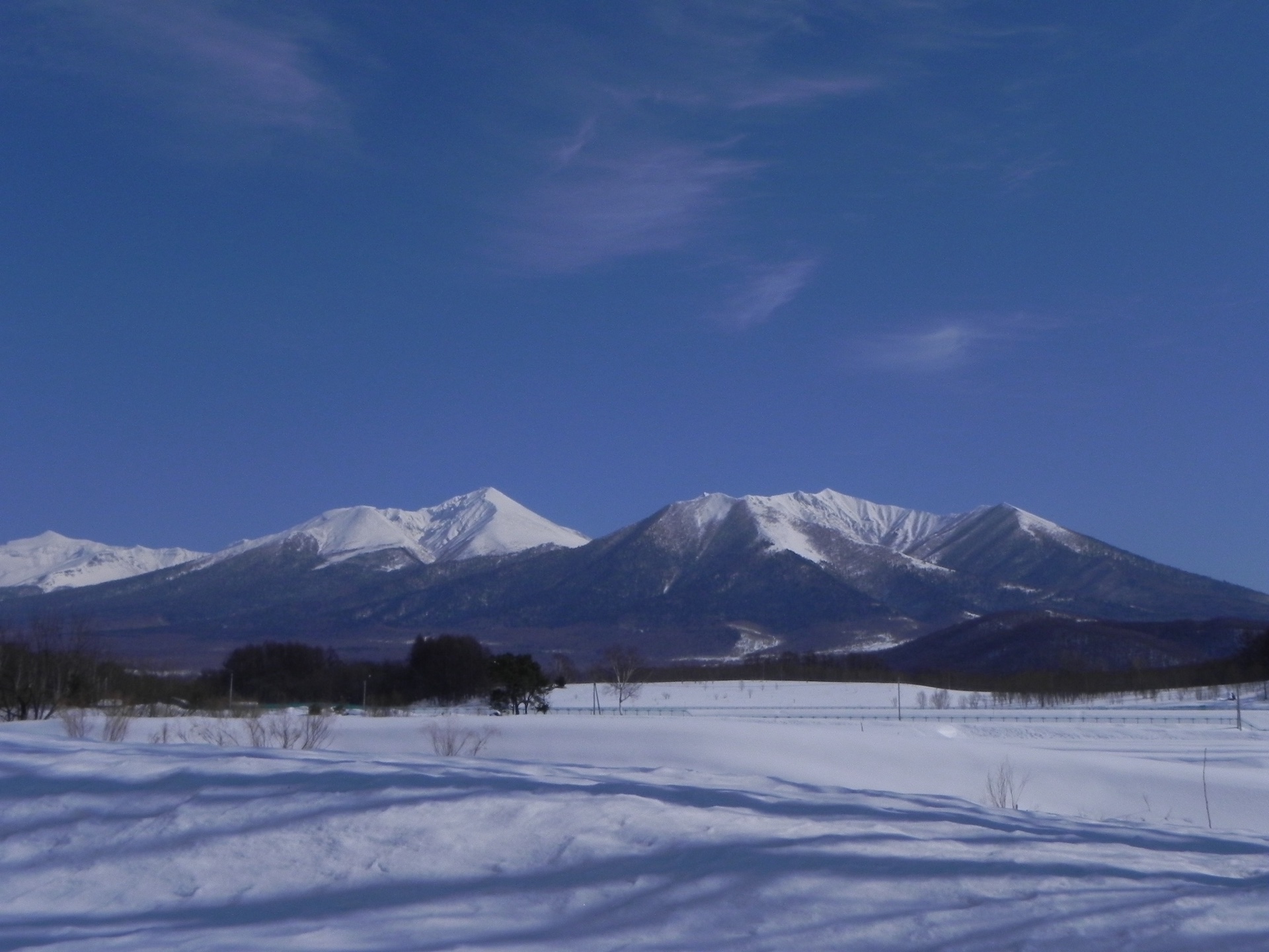 Mount Furano and Mount Maefurano across a snowy central Hokkaido plain