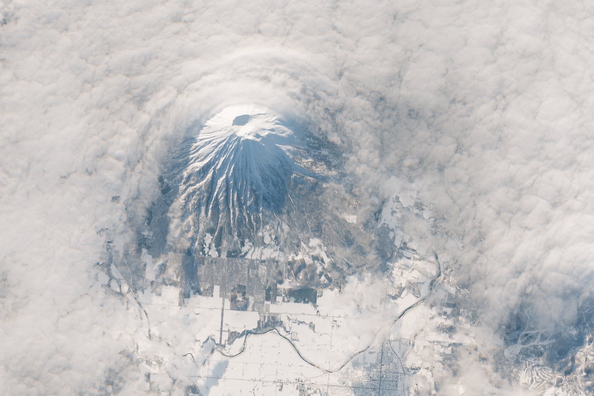 Cloud wrapping around the upper cone of Mount Yōtei