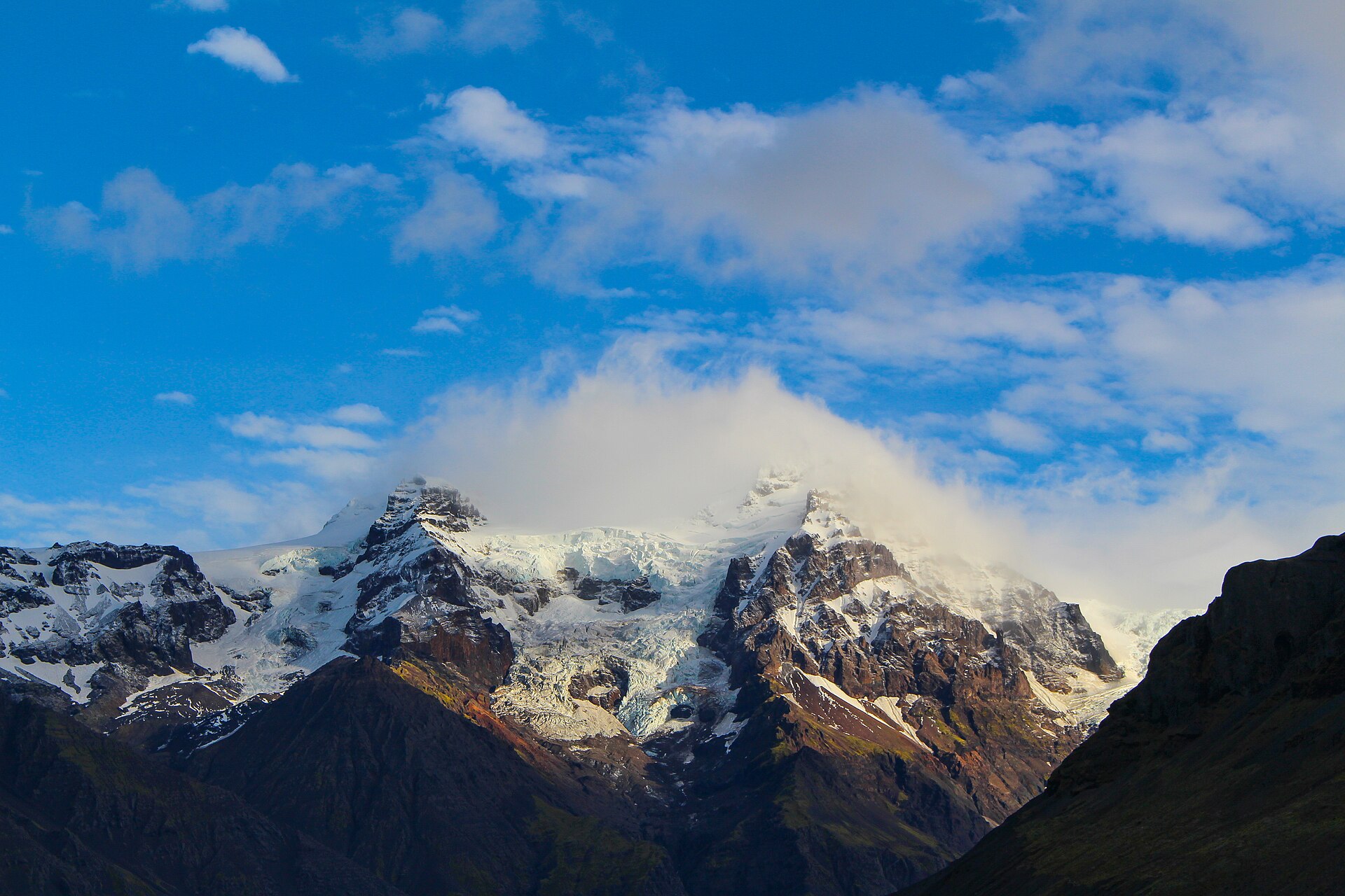 The glaciated summit massif of Hvannadalshnúkur above clouds