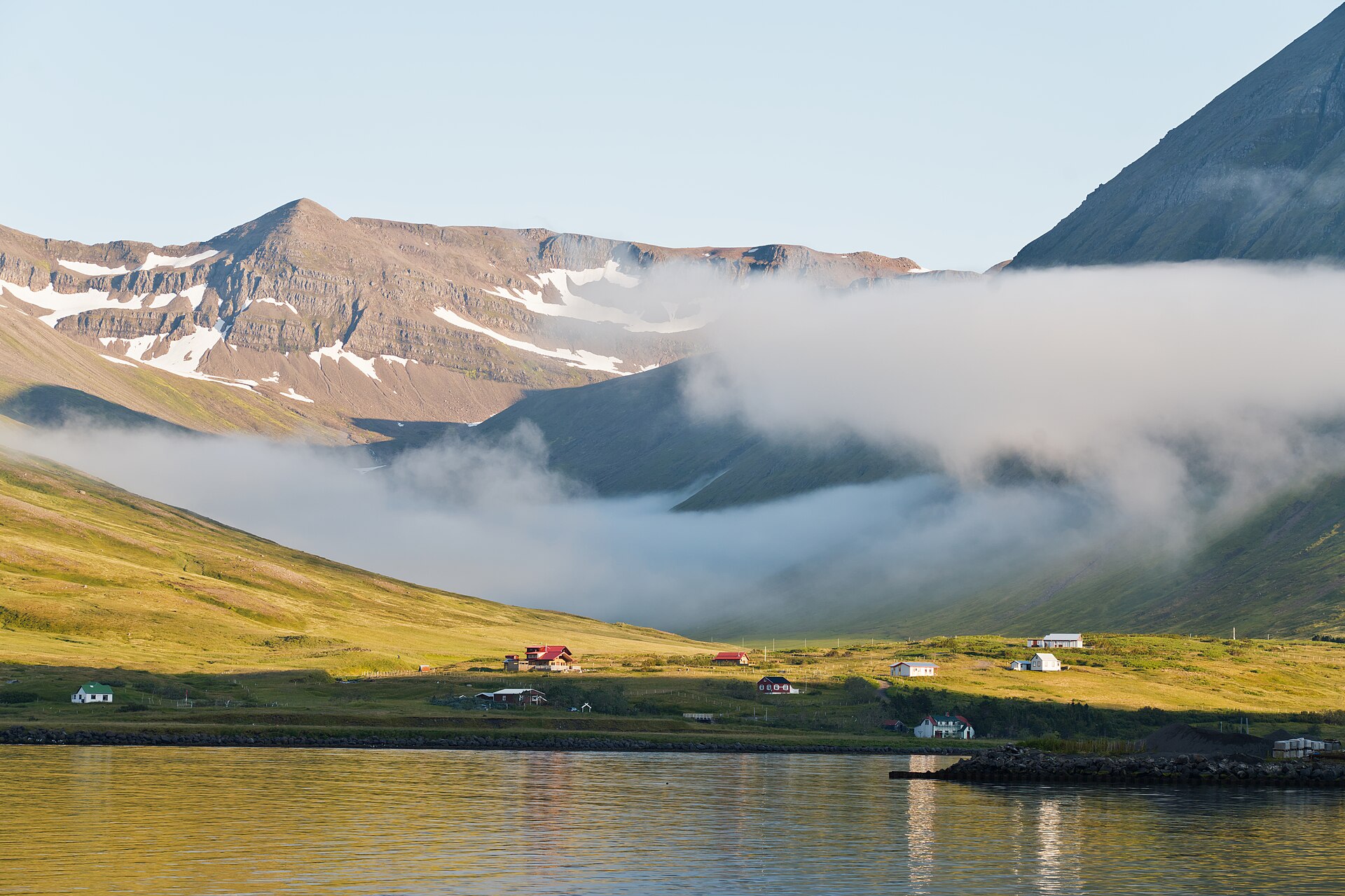 The steep-sided Skútuá valley rising behind Siglufjörður
