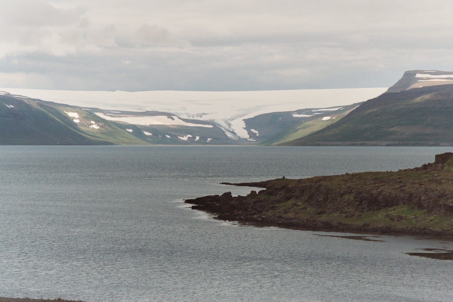 Drangajökull flowing towards a fjord in Iceland's Westfjords