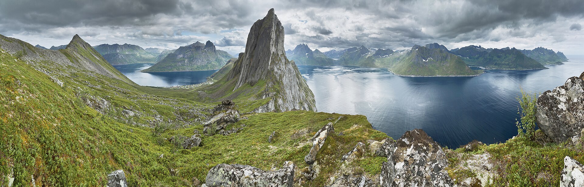 A wide panorama of Segla and the surrounding ridges and fjords of Senja