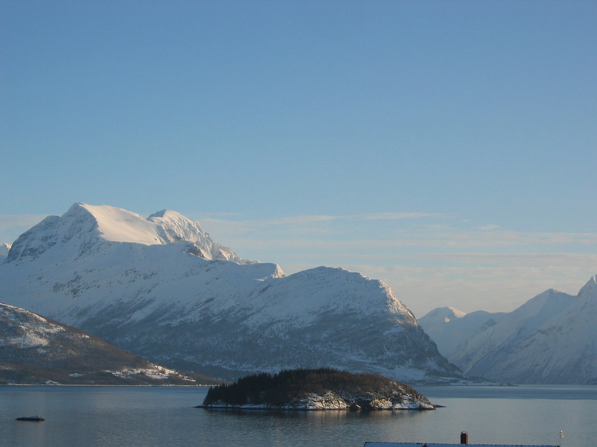 The snow-covered Sunnmøre Alps seen across Storfjorden