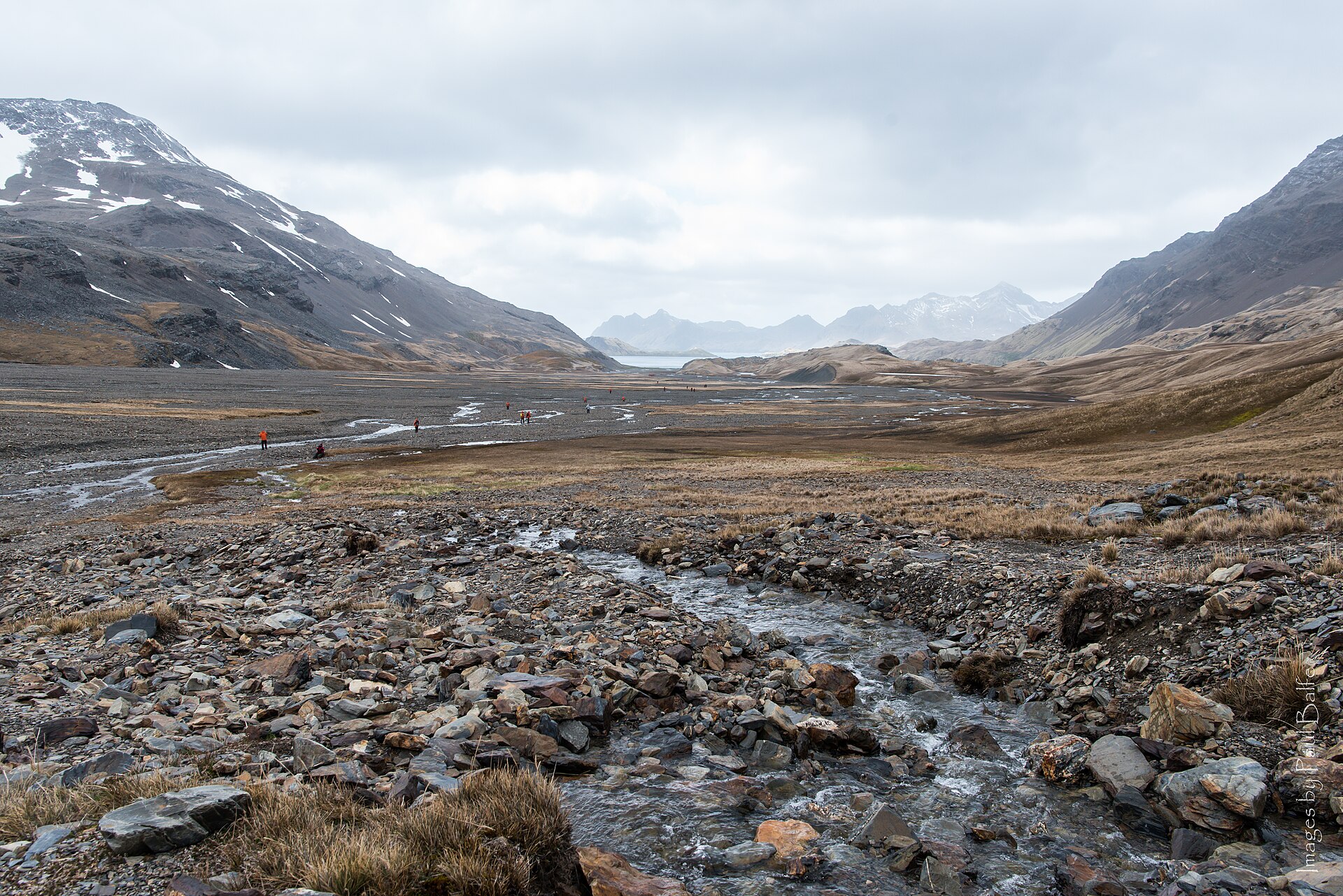 The rocky floor and snow-streaked slopes of Shackleton Valley in South Georgia