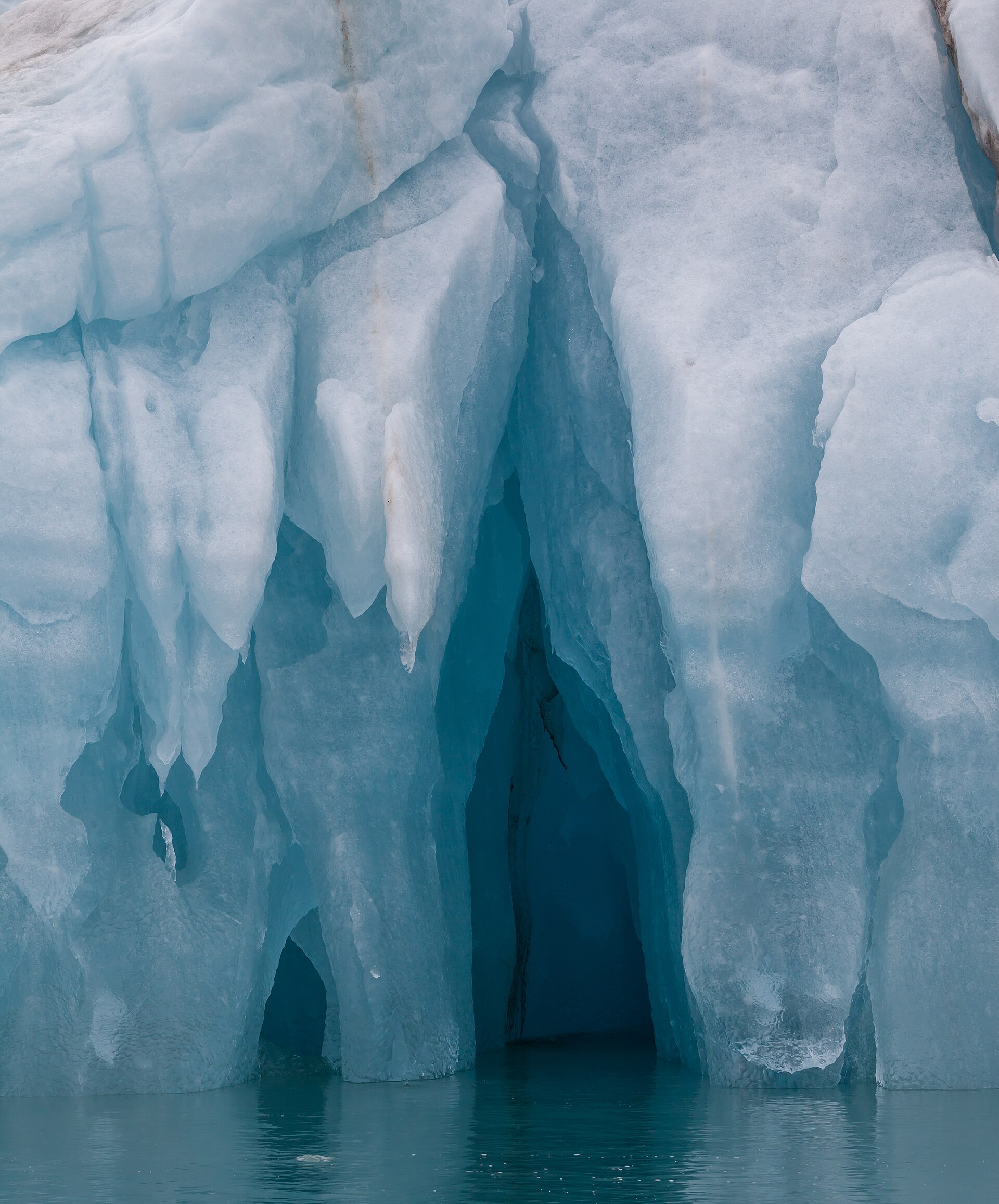 Deep blue cavity inside an iceberg in Liefdefjorden, Svalbard