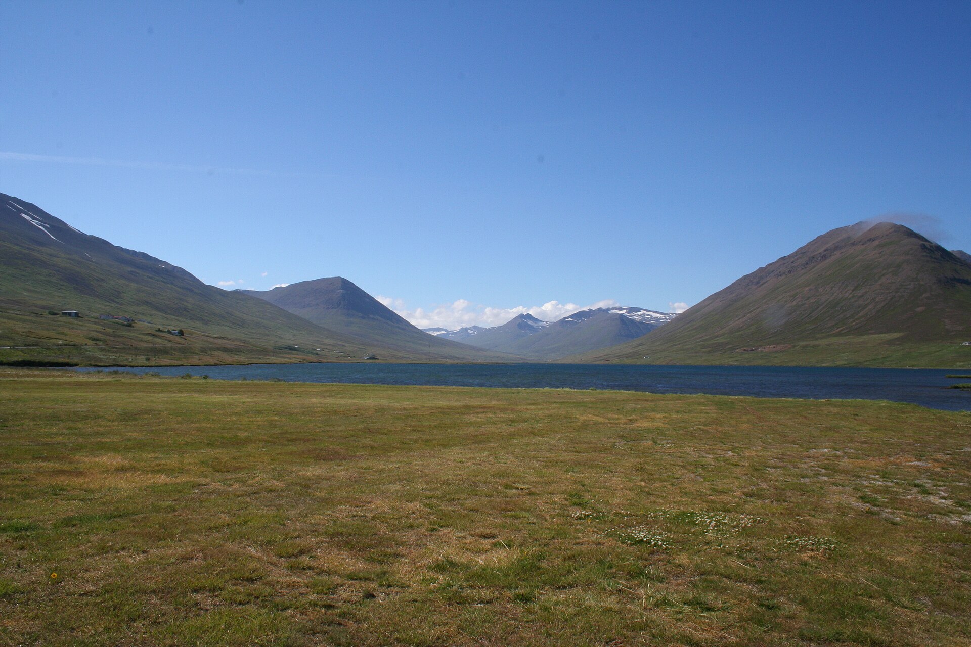Ólafsfjarðarvatn framed by the open mountains behind Ólafsfjörður