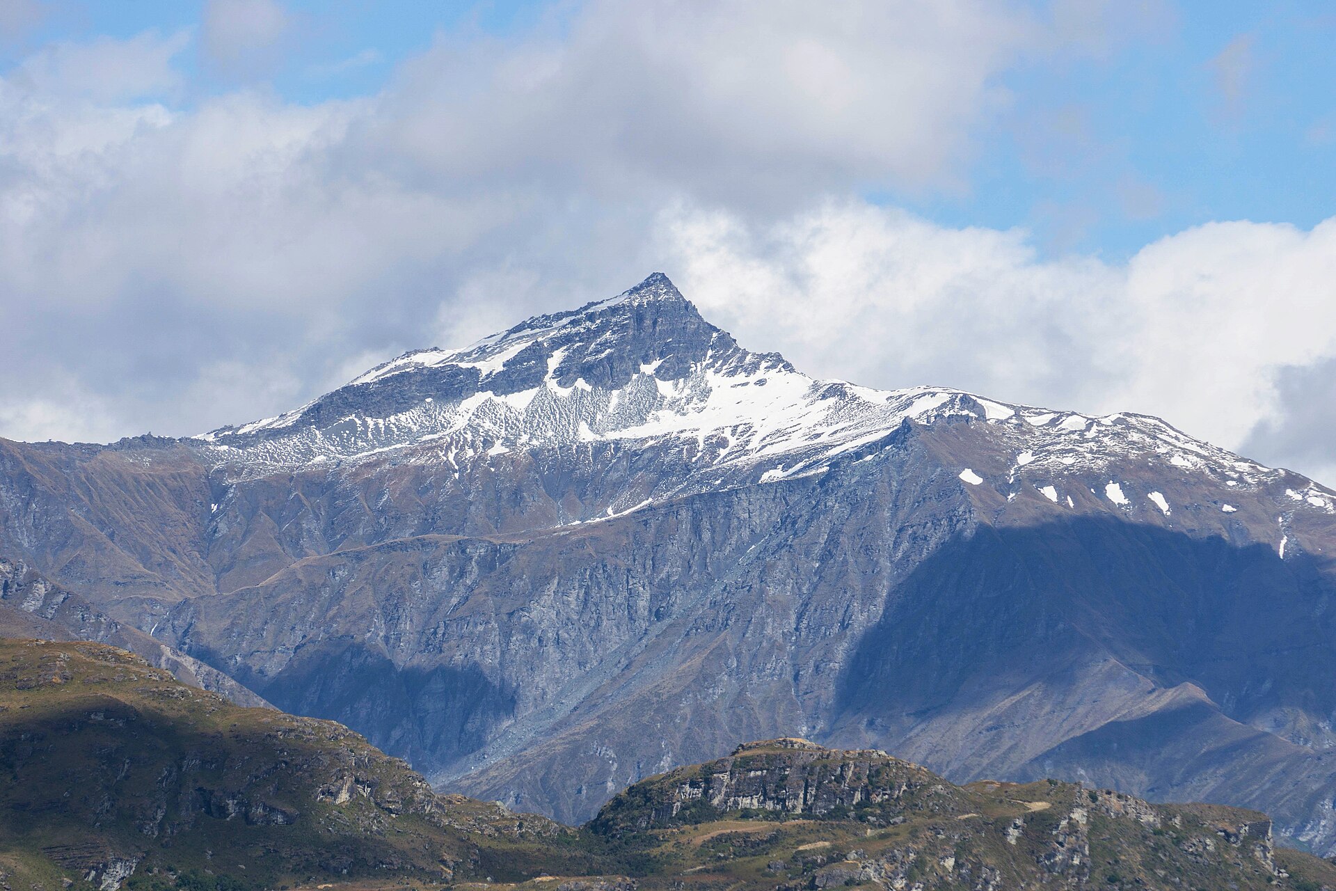 The snow-streaked east face of Black Peak in the Harris Mountains