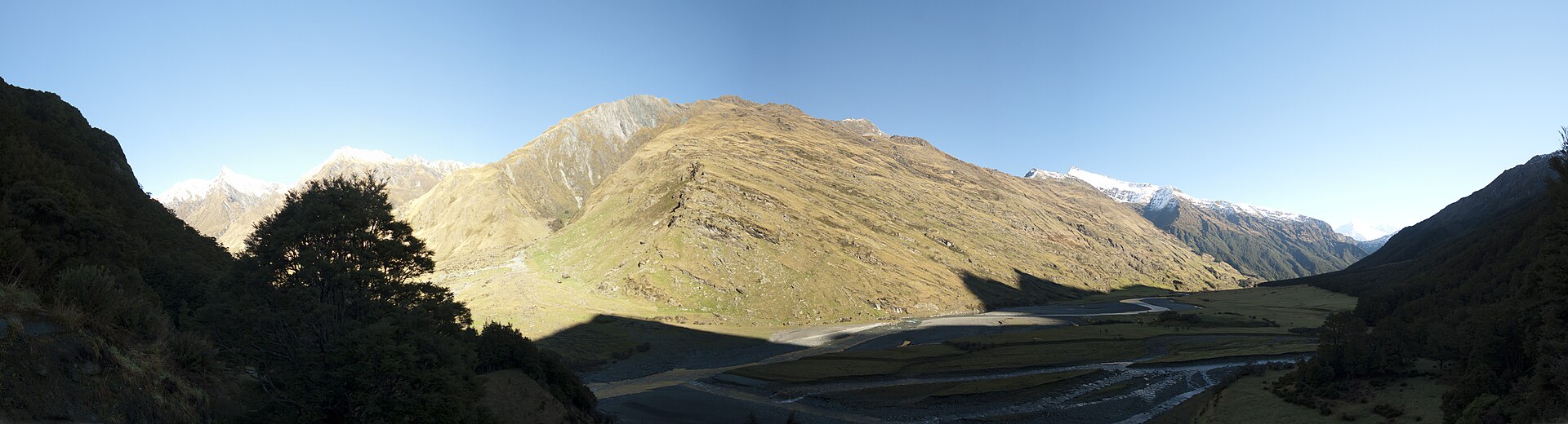 Wide panorama of the Matukituki River Valley beneath high mountains