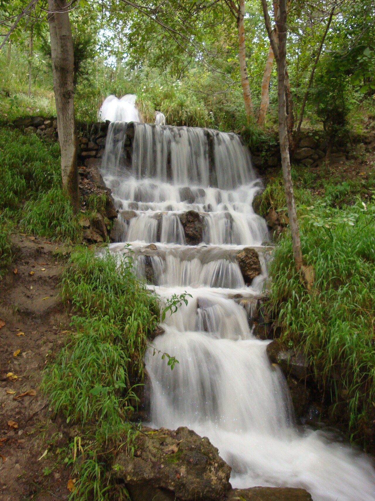 Water cascading over a rock ledge at Arslanbob