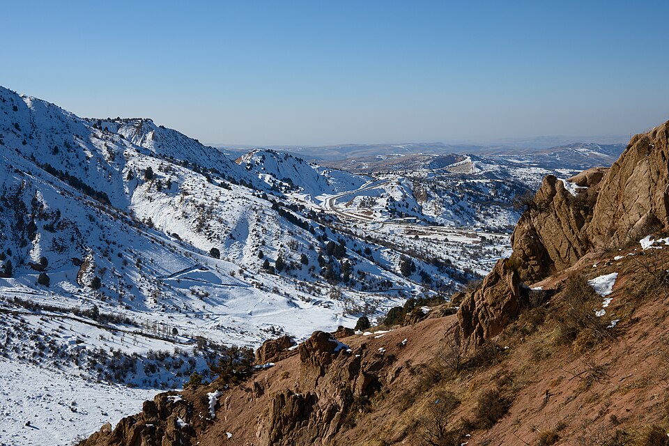 First snow covering the ridges and juniper slopes of Chimgan