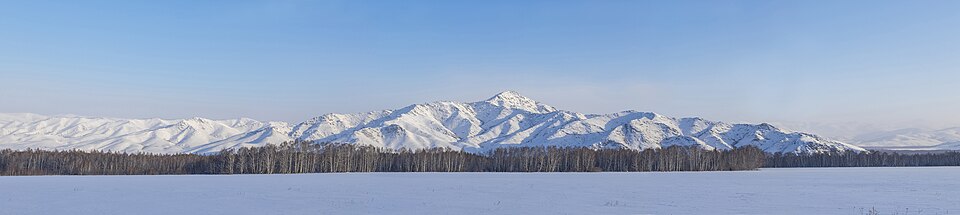 Rounded snow-covered mountains in the wider Kazakh Altai