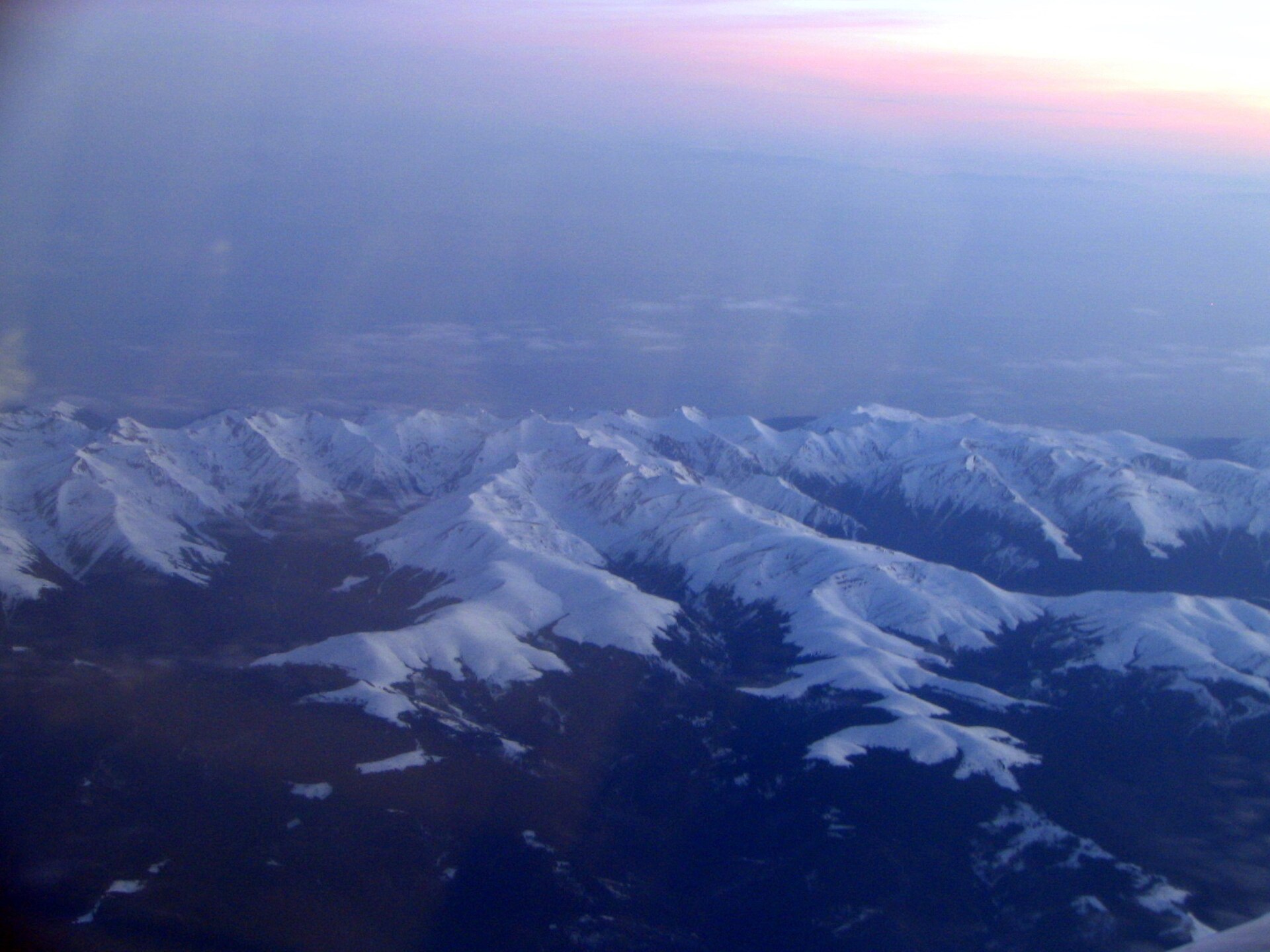 Aerial view along the snow-covered Făgăraș ridge