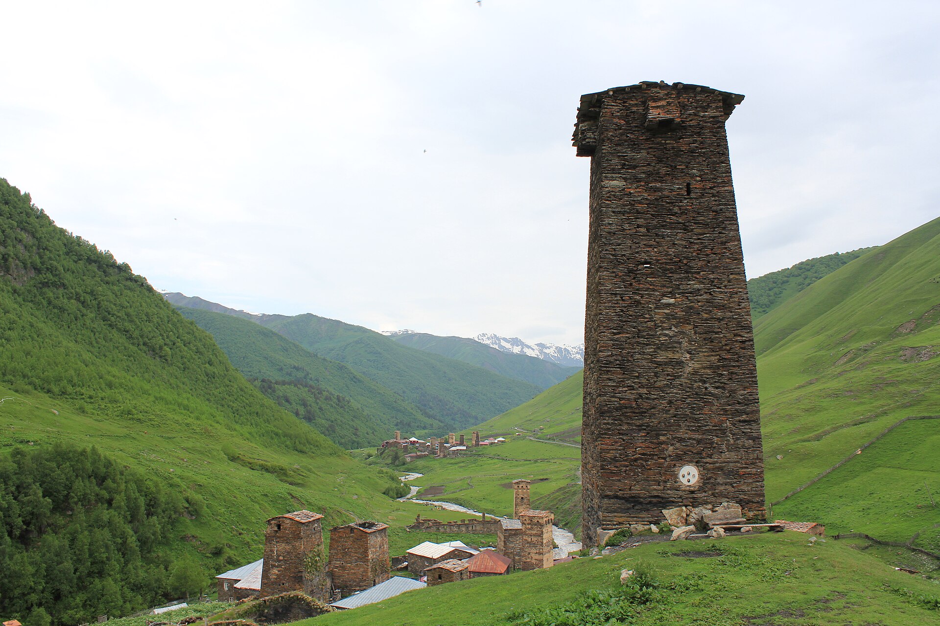 A medieval Svan tower rising above houses in Ushguli