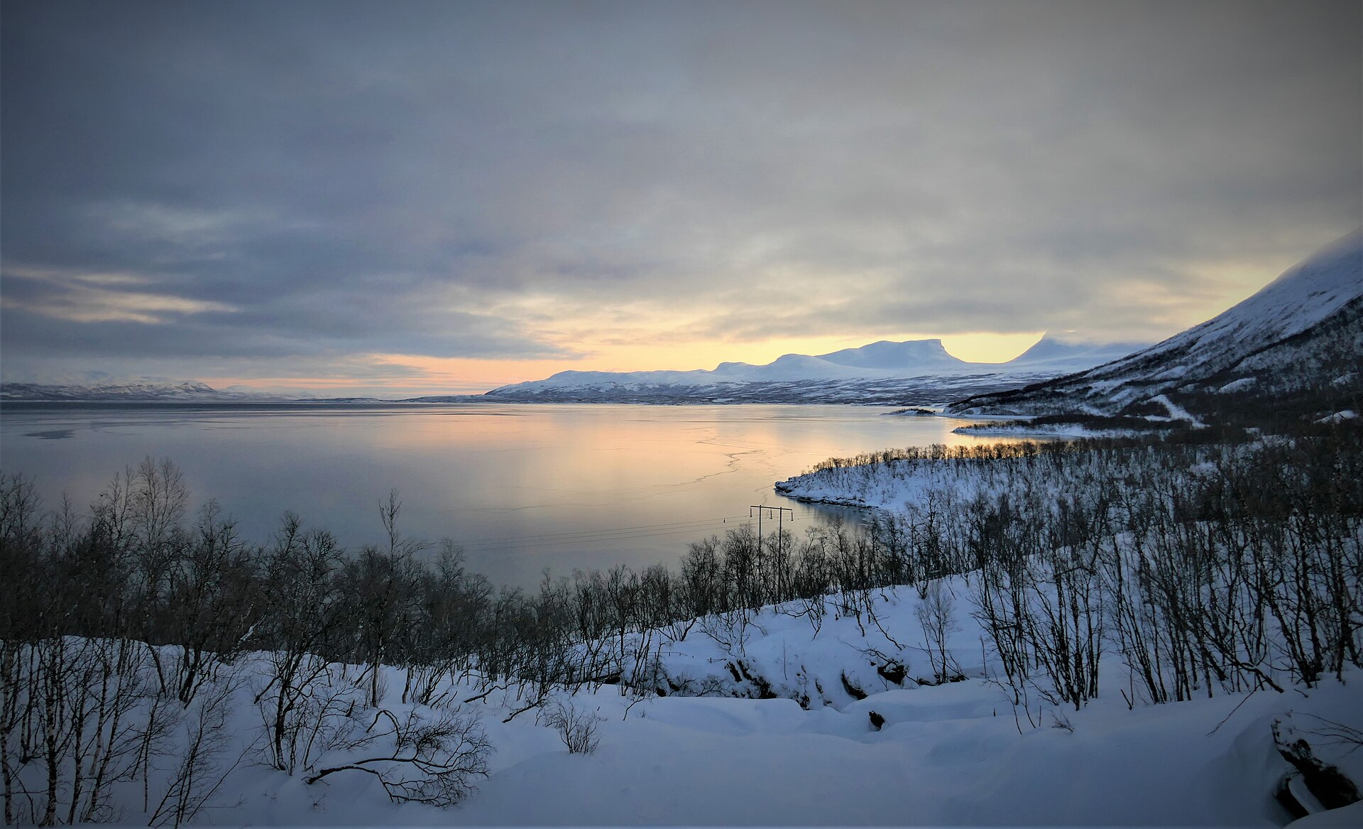 Snow-covered mountains and Torneträsk seen from Abisko National Park