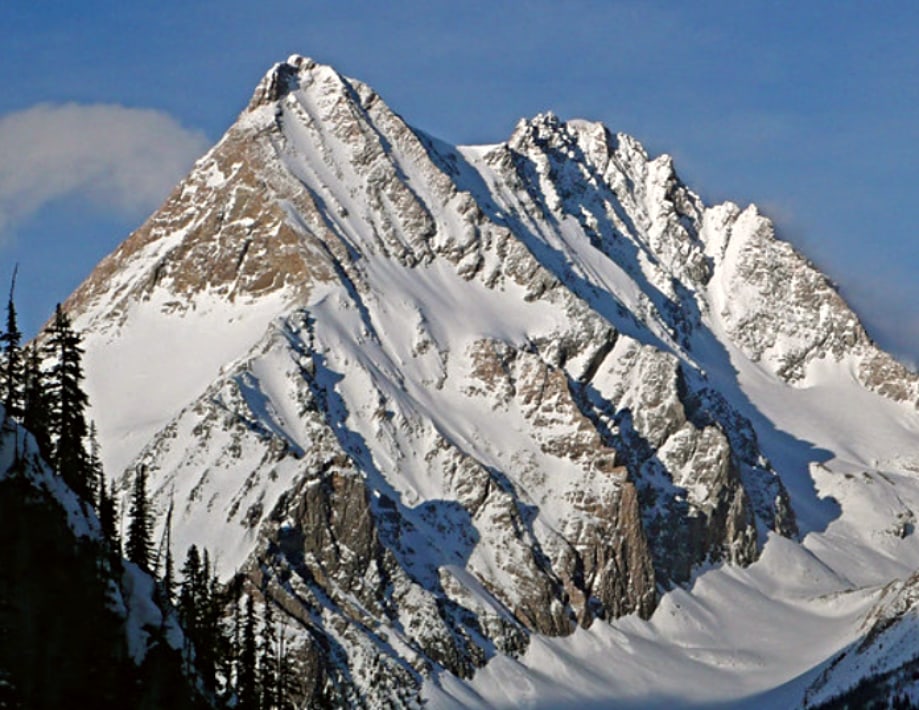 Karnak Mountain covered in winter snow in the Purcell Mountains