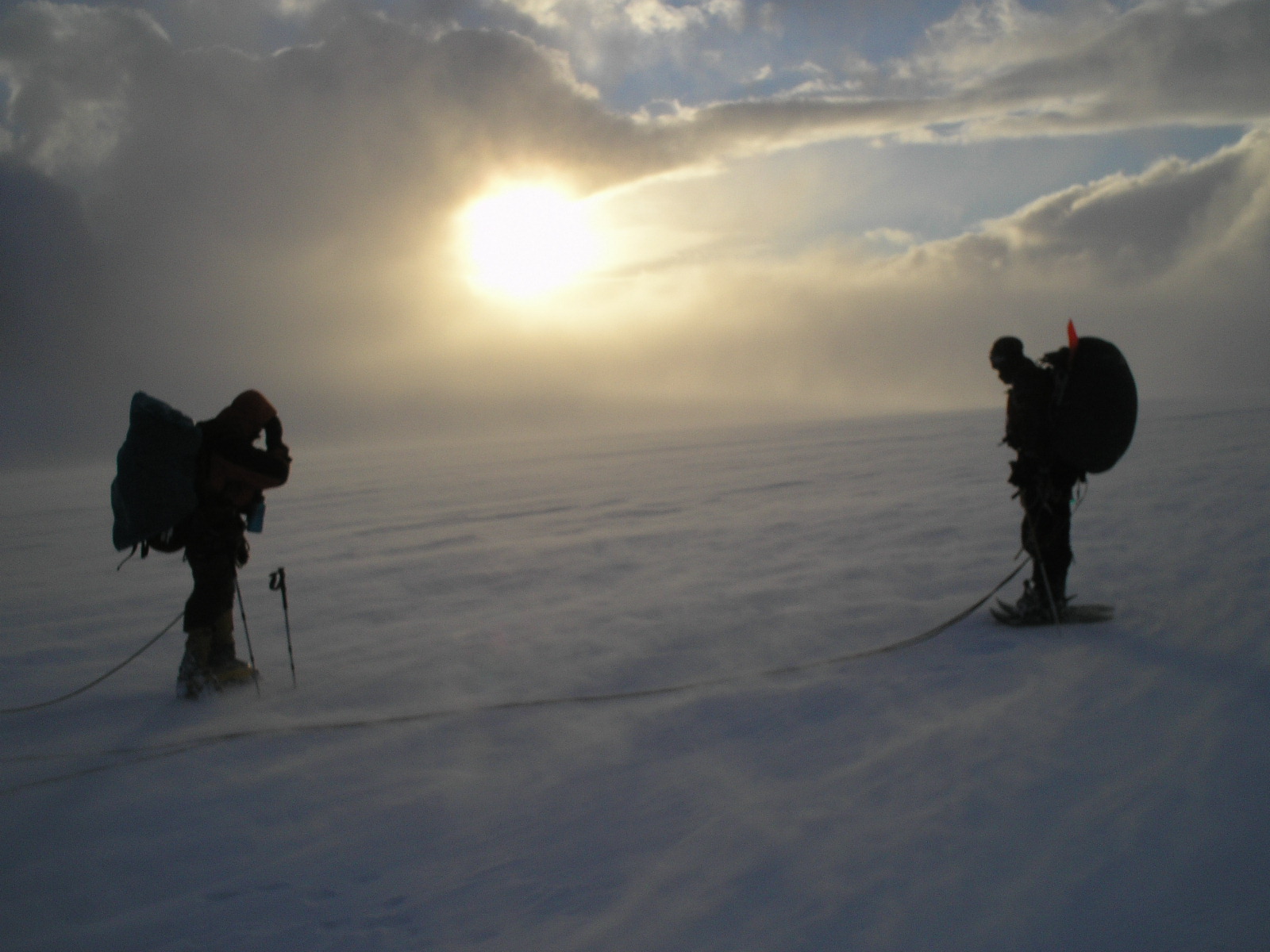 Two expedition travellers moving across the Southern Patagonian Ice Field from Paso Marconi