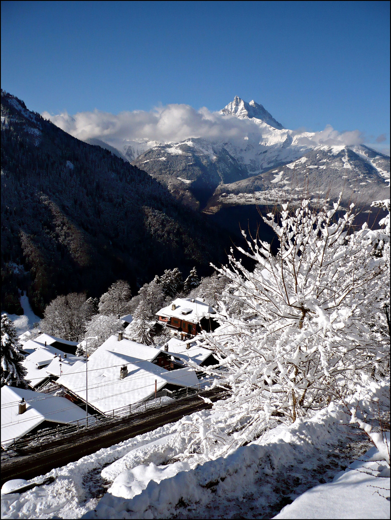 Snow-covered chalets and mountains at Gryon in the canton of Vaud