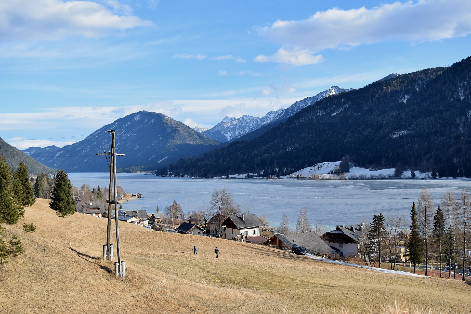 A winter view over Weissensee toward the mountains of Carinthia